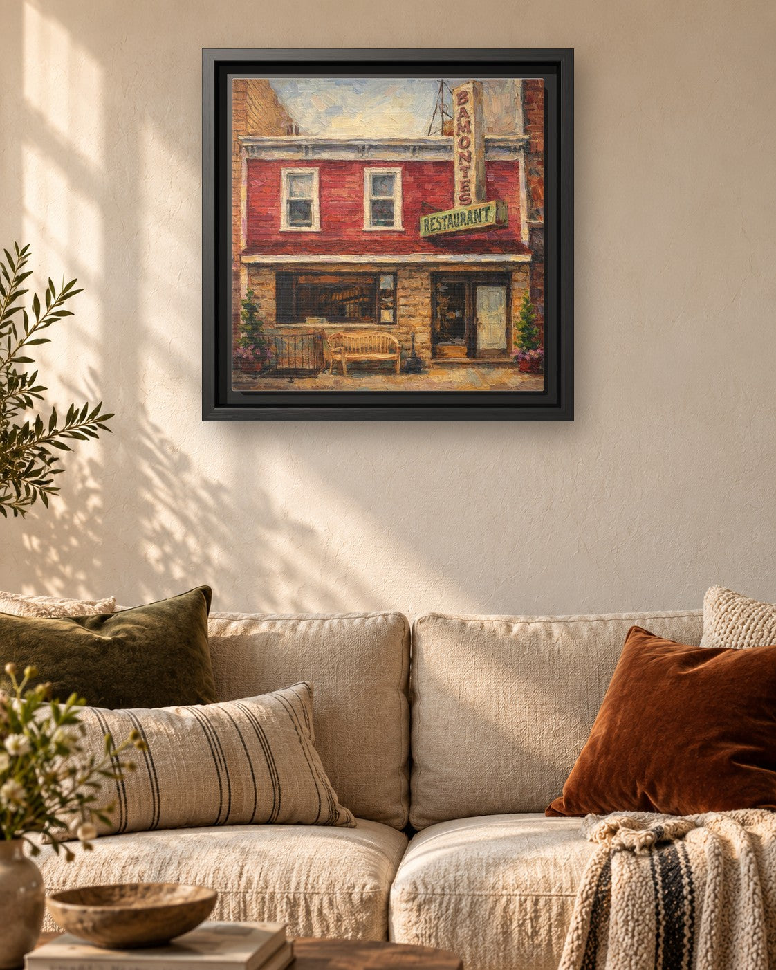 Bamonte's framed canvas print hanging above a sofa