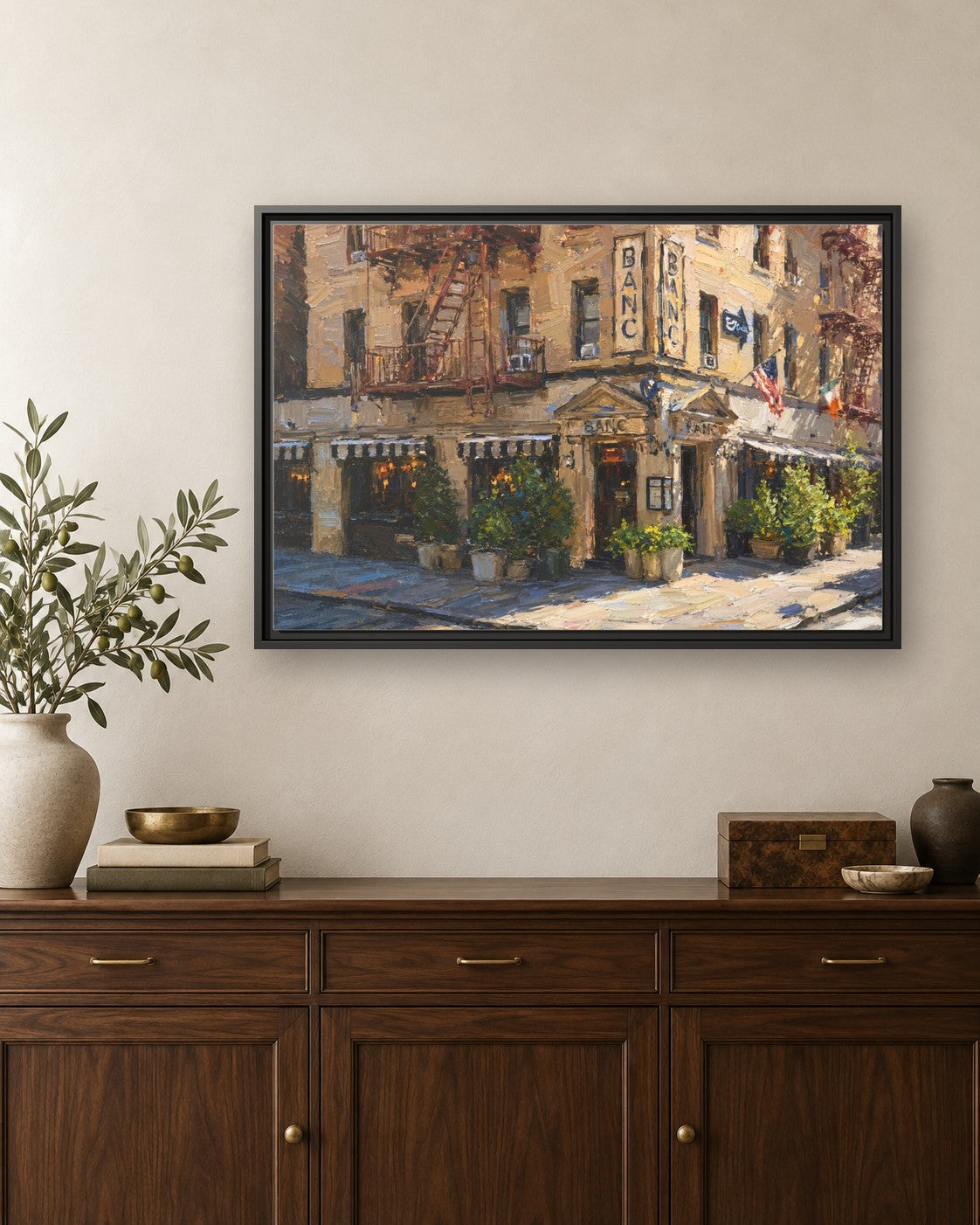 Banc Cafe framed canvas print hanging above a credenza