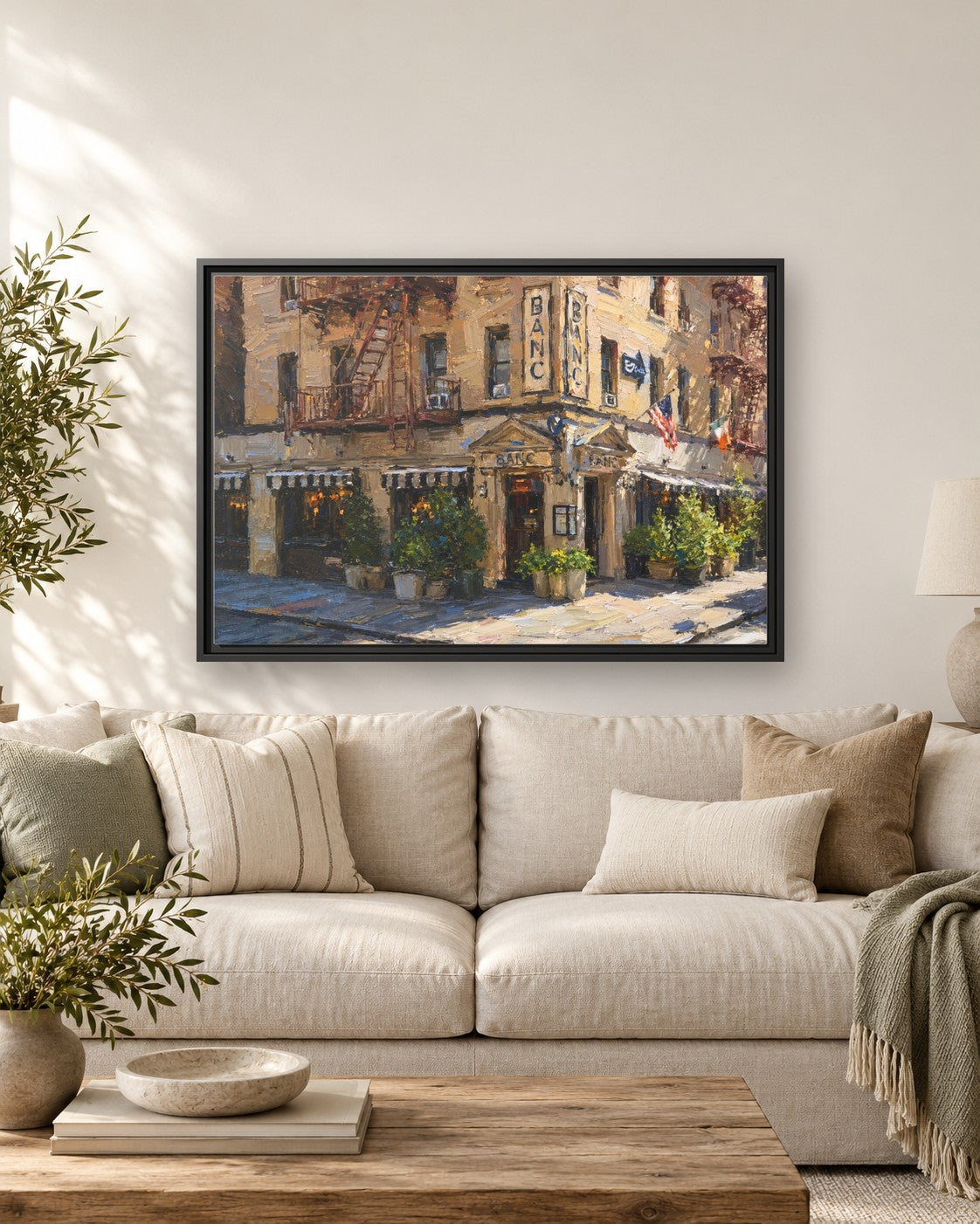 Banc Cafe framed canvas print hanging above a sofa