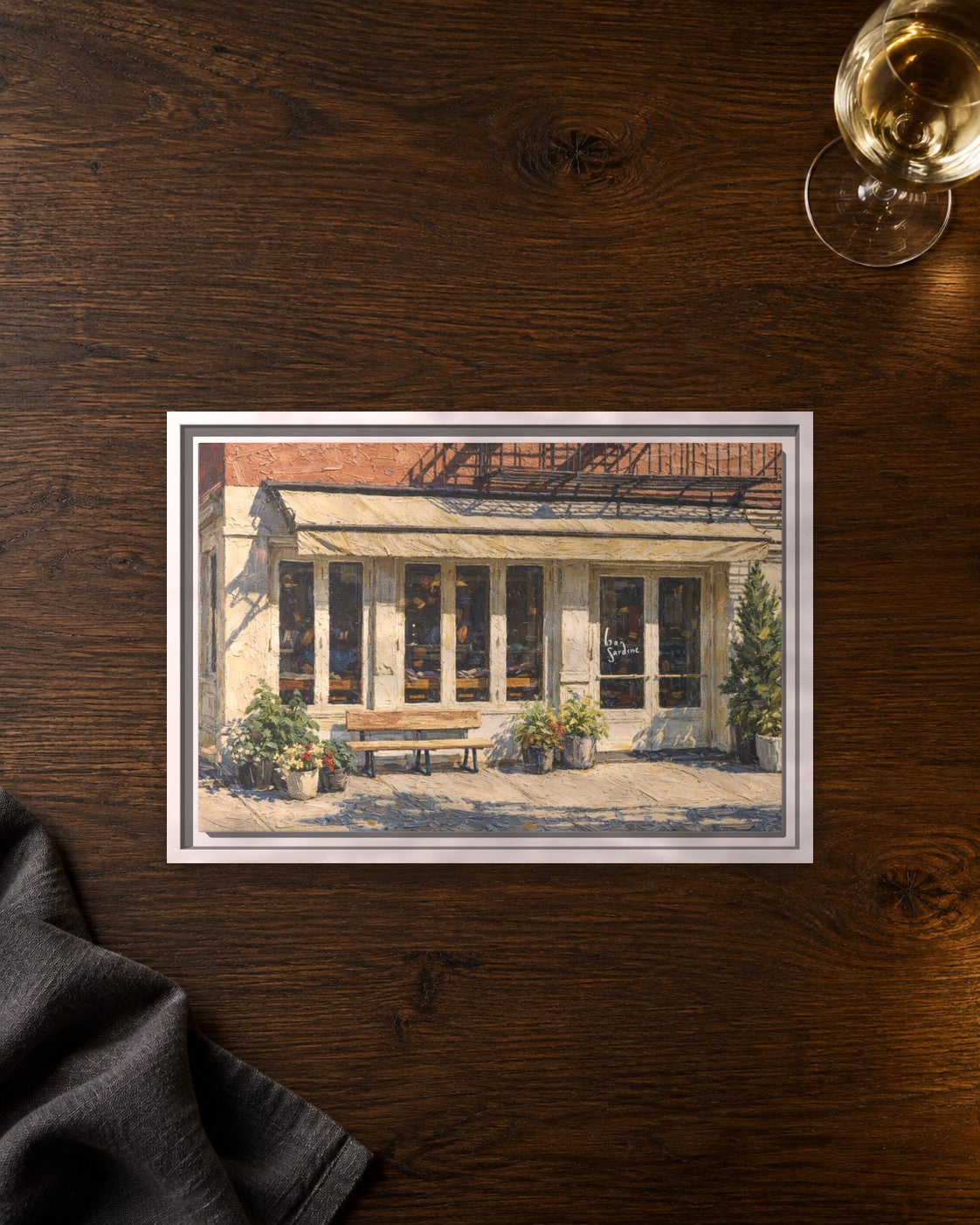 Bar Sardine framed canvas print lying on a table