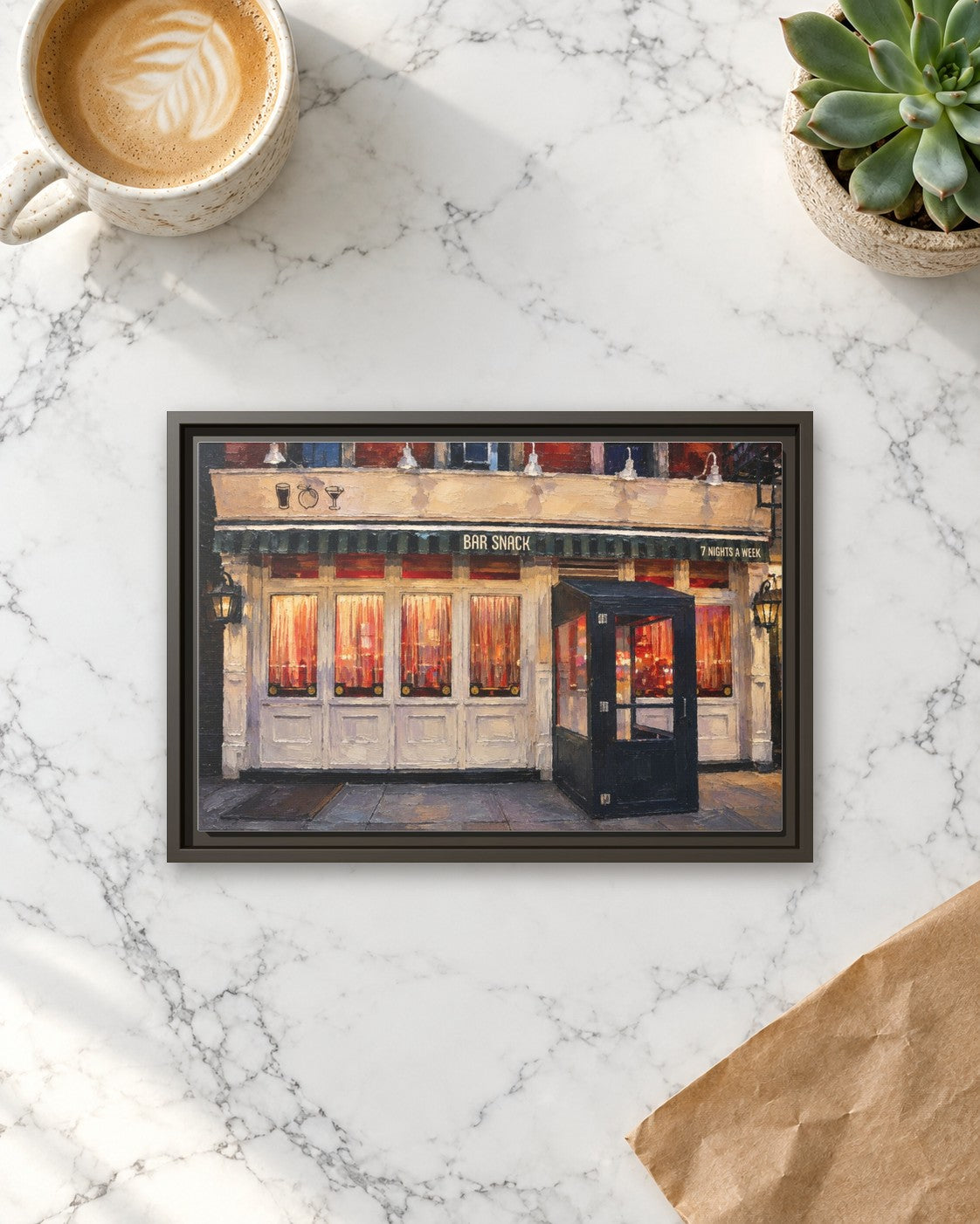 Bar Snack framed canvas print lying on a table
