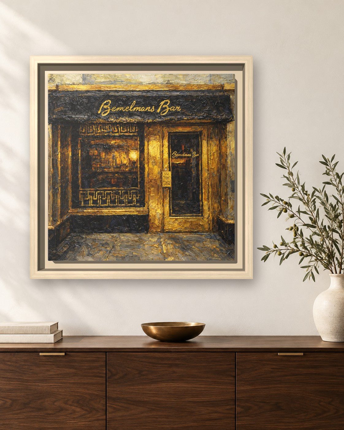 Bemelmans Bar framed canvas print hanging above a sideboard