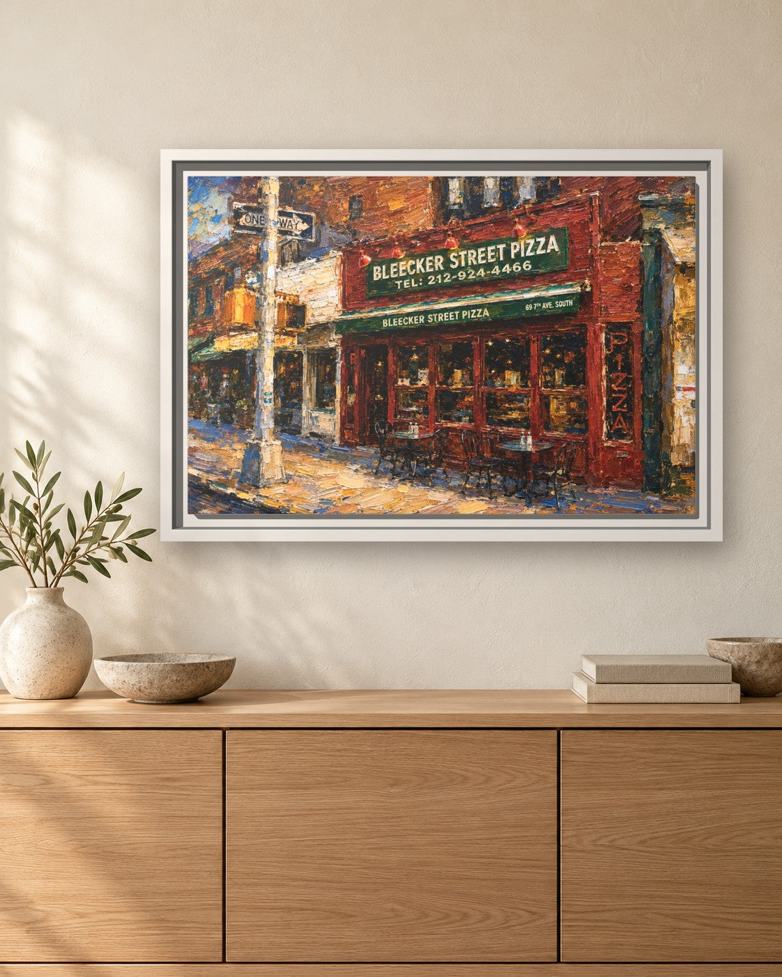 Bleecker Street Pizza framed canvas print hanging above a sideboard