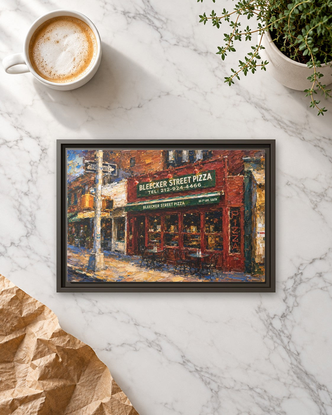 Bleecker Street Pizza framed canvas print lying on a table