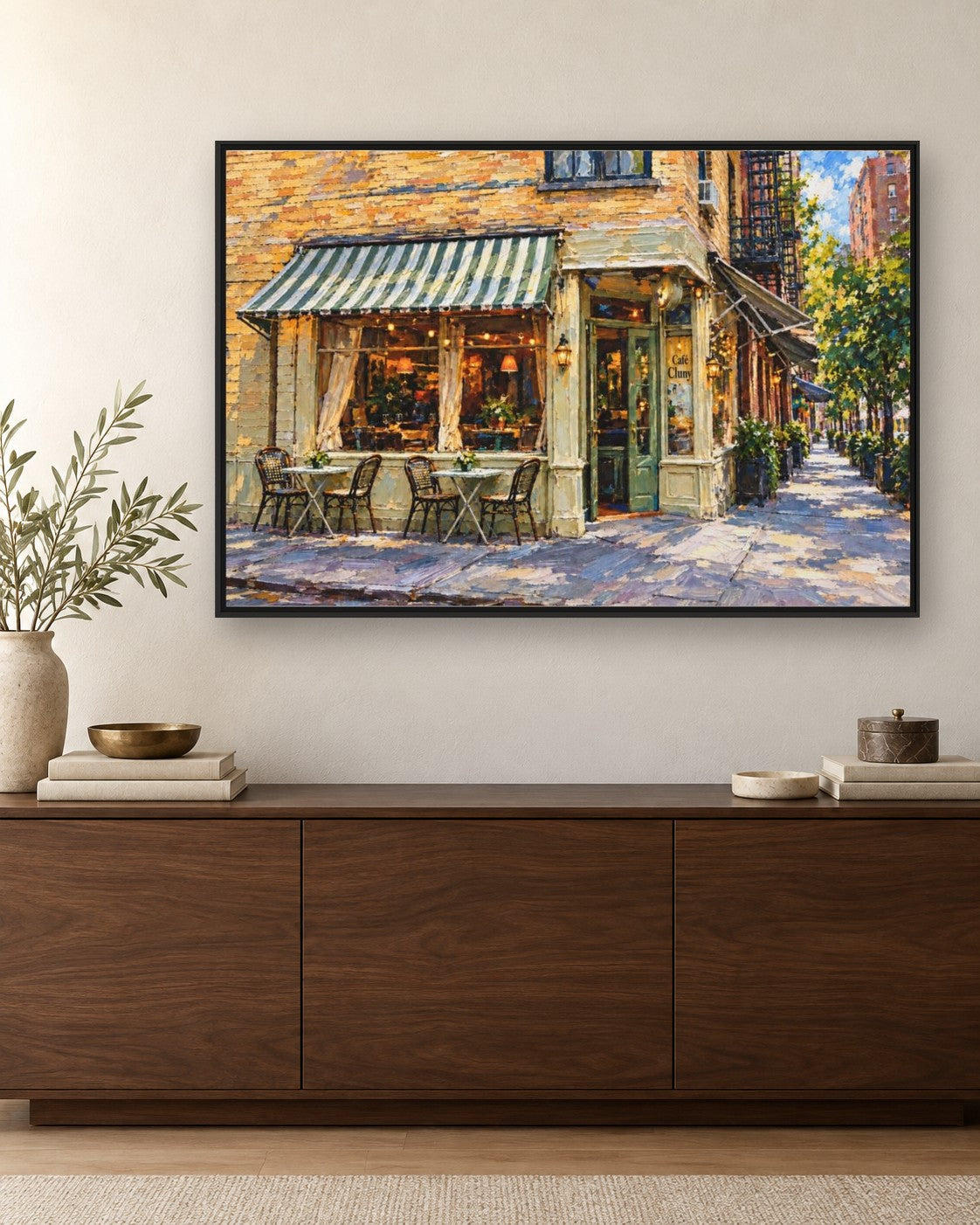 Cafe Cluny framed canvas print hanging above a credenza