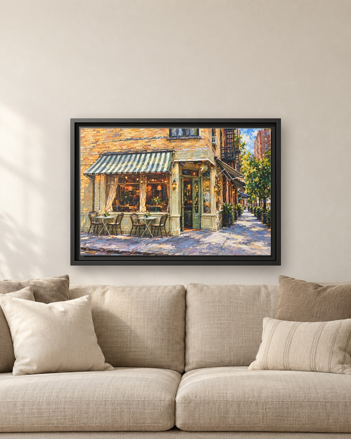 Cafe Cluny framed canvas print hanging above a sofa