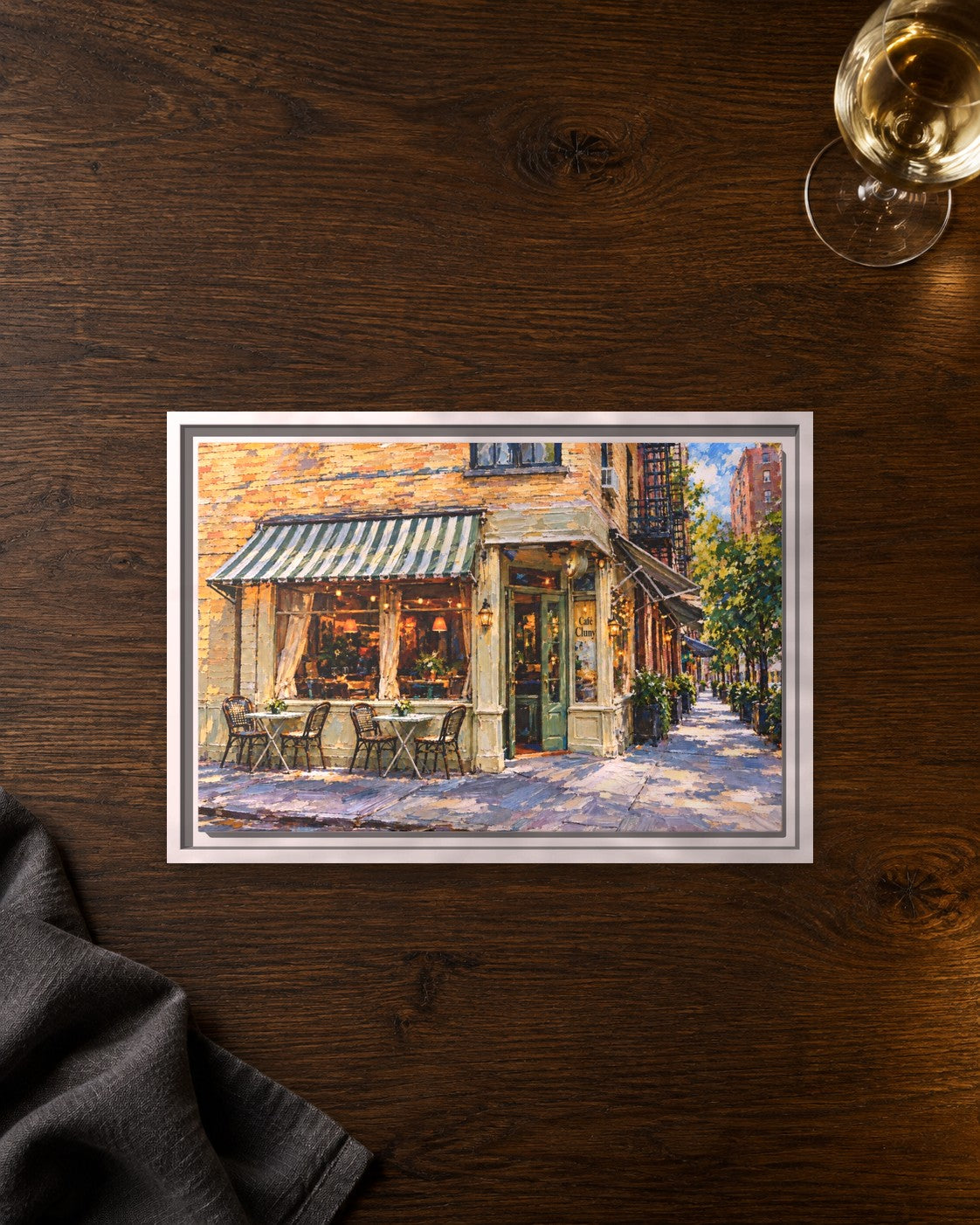 Cafe Cluny framed canvas print lying on a table