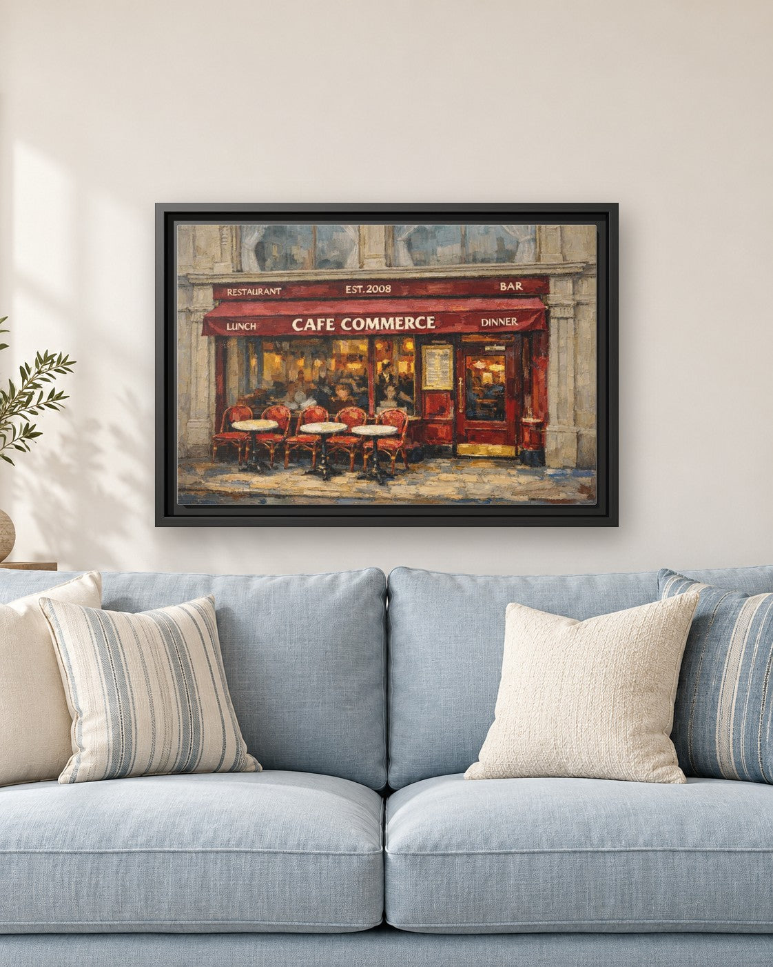 Cafe Commerce framed canvas print hanging above a sofa