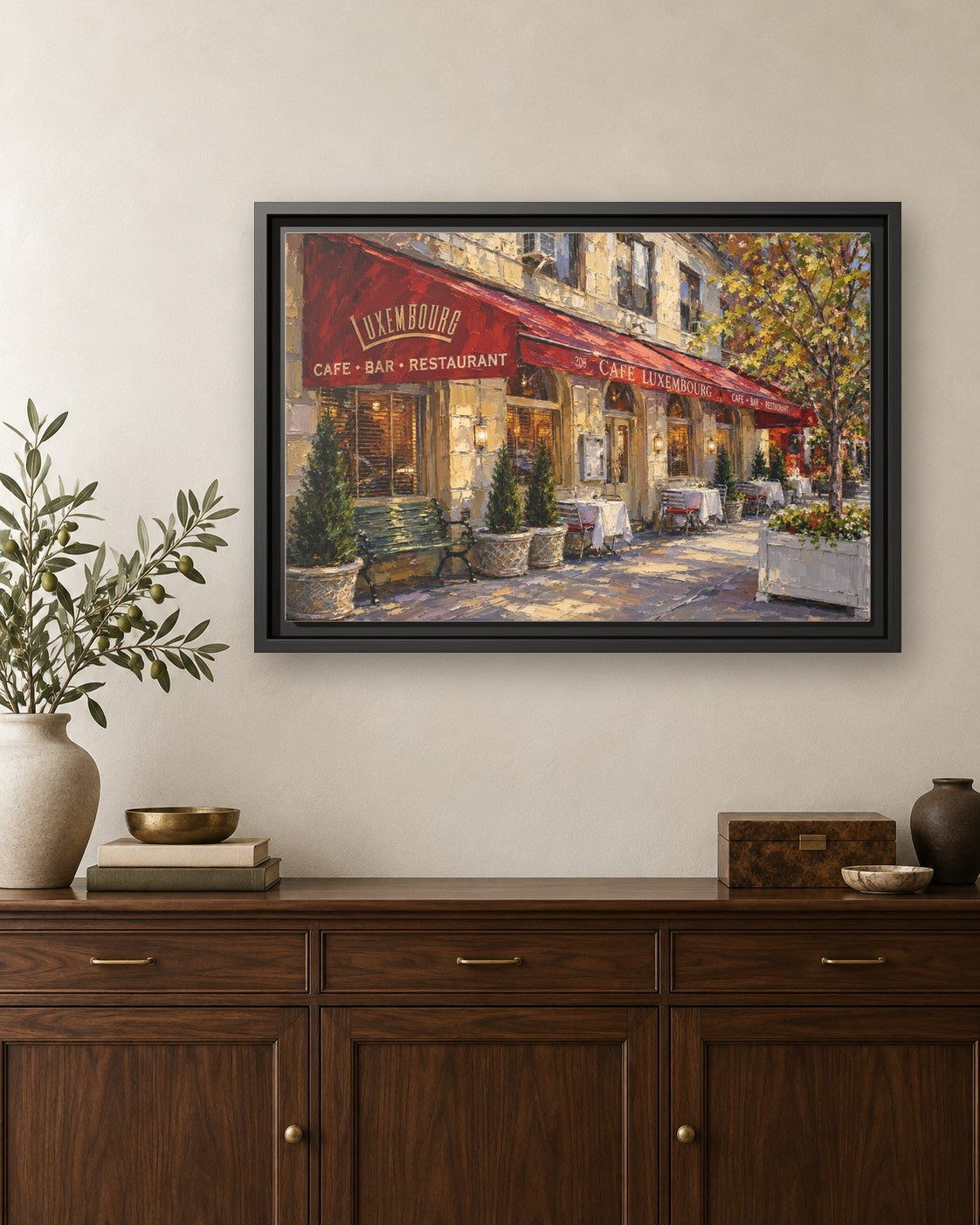 Cafe Luxembourg framed canvas print hanging above a credenza