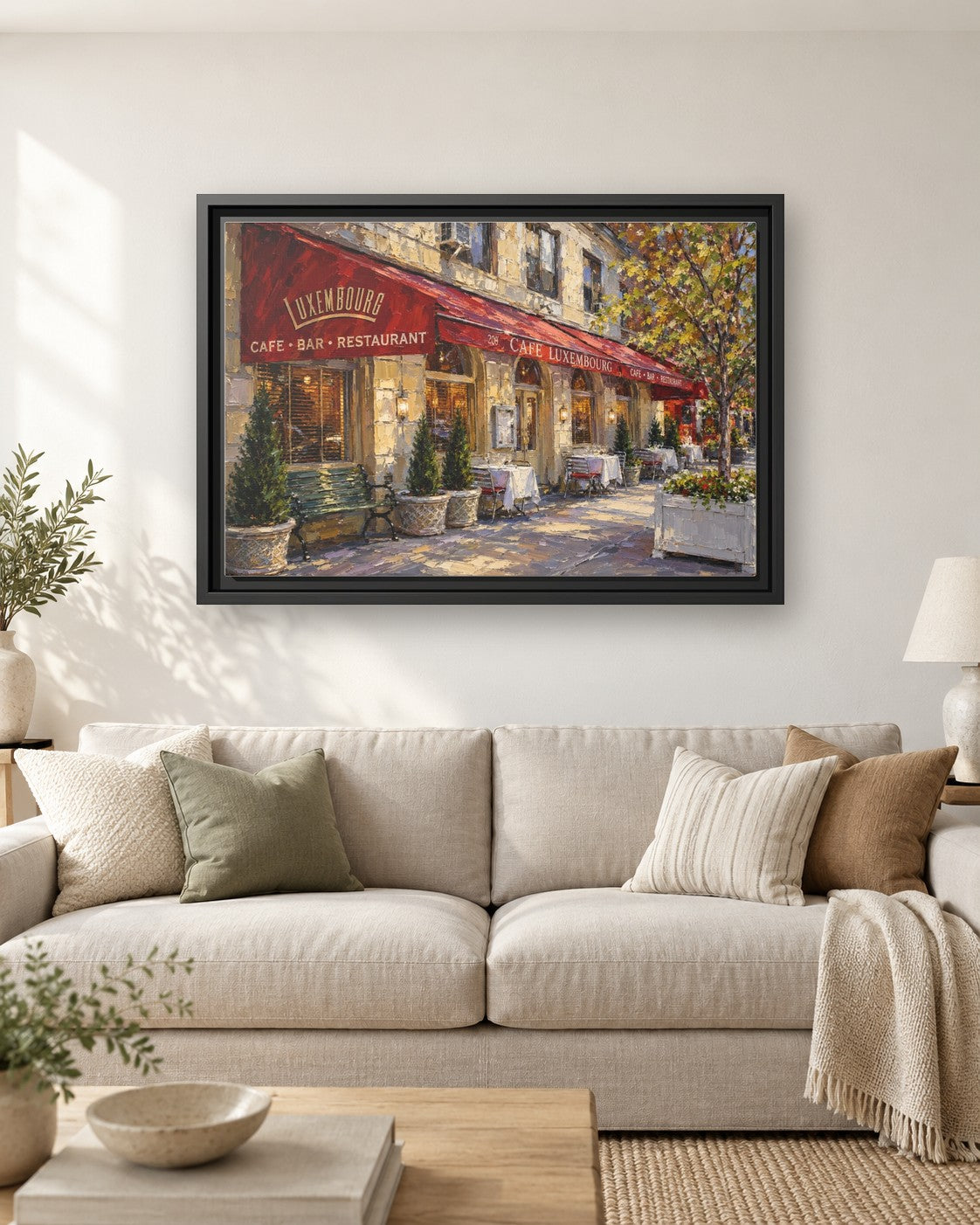 Cafe Luxembourg framed canvas print hanging above a sofa