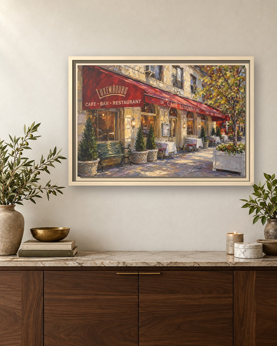 Cafe Luxembourg framed canvas print hanging above a sideboard