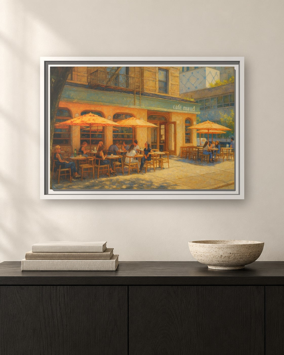 Café Maud framed canvas print hanging above a sideboard