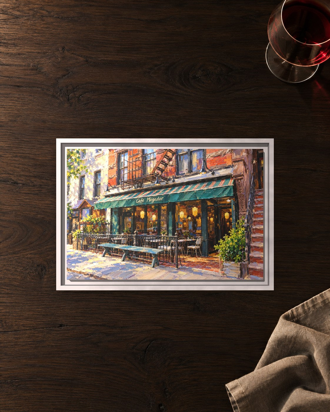 Cafe Mogador framed canvas print lying on a table