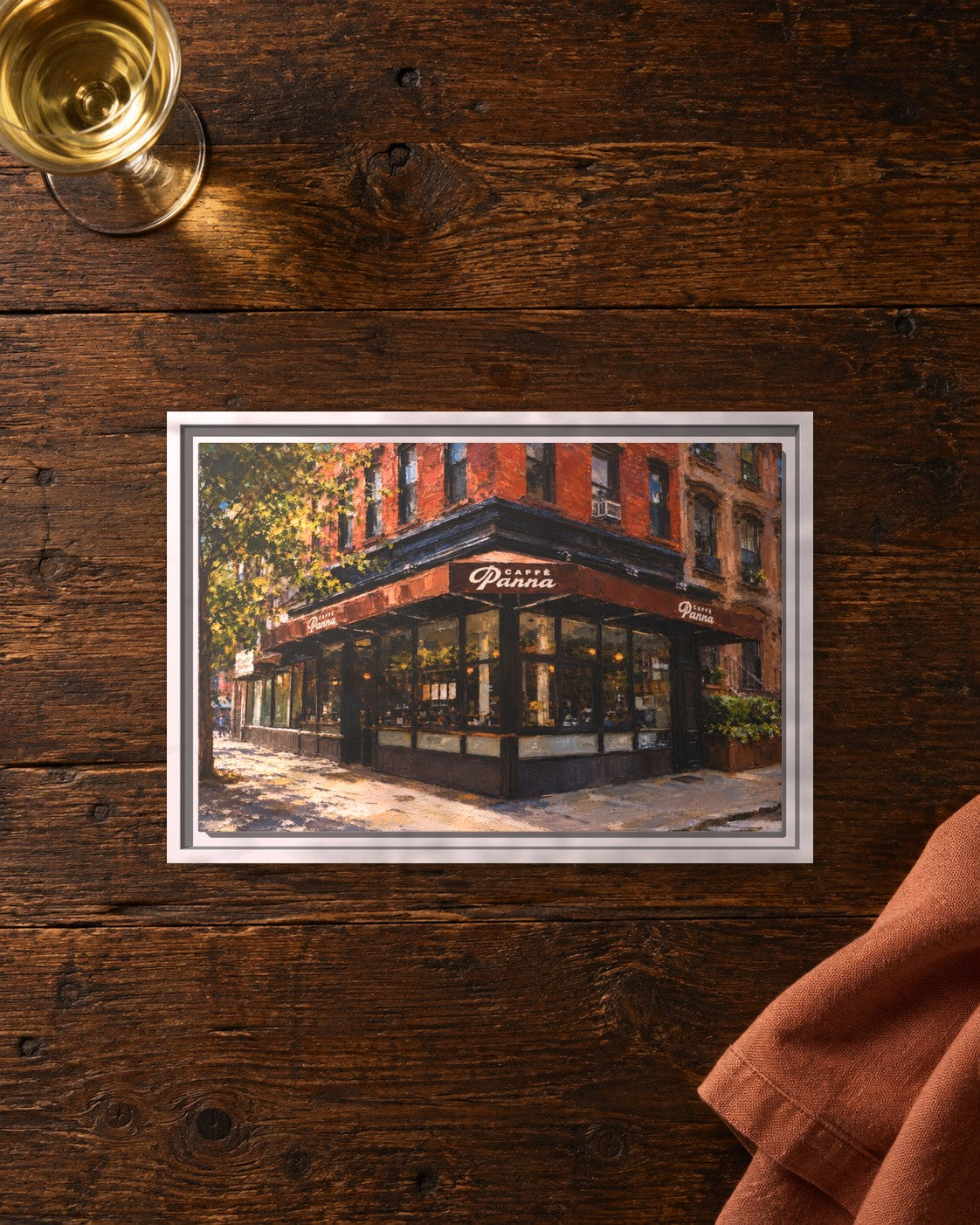 Caffe Panna framed canvas print lying on a table
