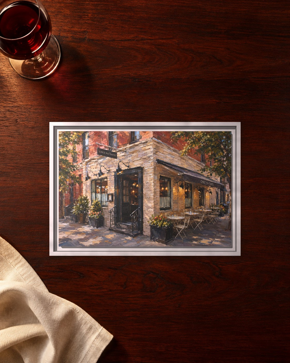 Chez Ma Tante framed canvas print lying on a table