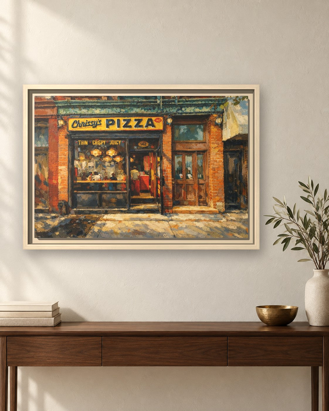Chrissy's Pizza framed canvas print hanging above a sideboard