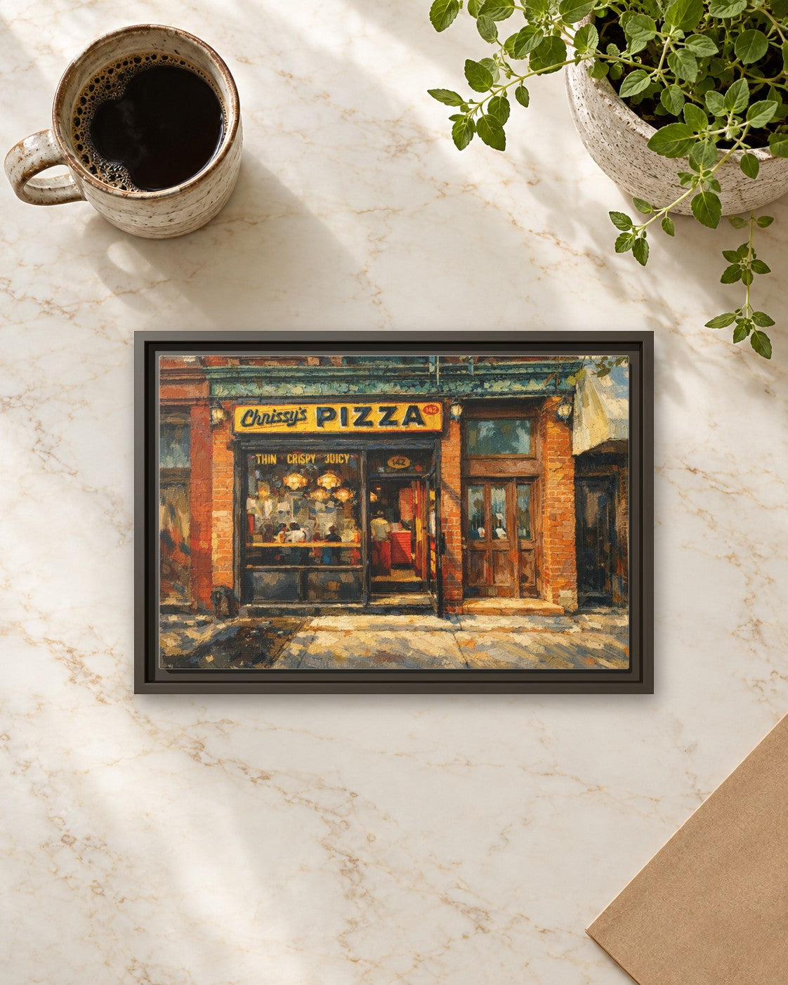 Chrissy's Pizza framed canvas print lying on a table