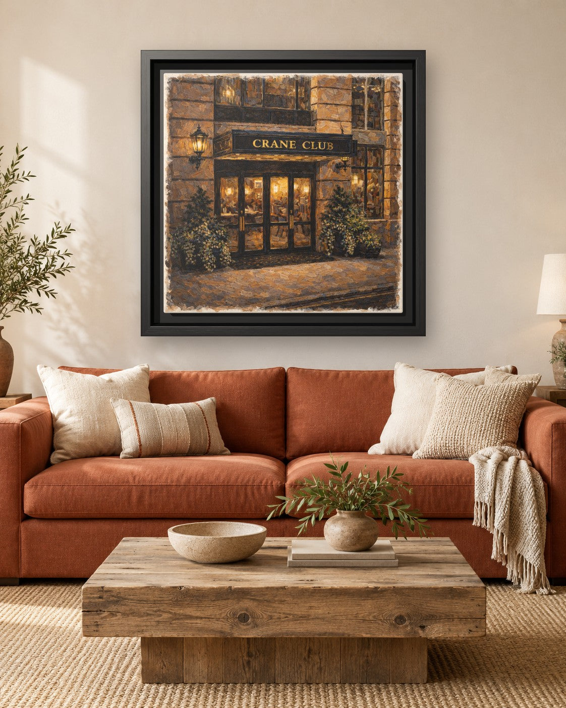 Crane Club framed canvas print hanging above a sofa