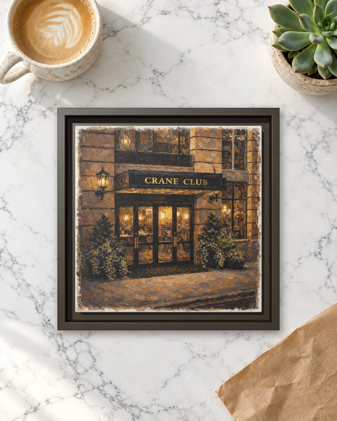 Crane Club framed canvas print lying on a table