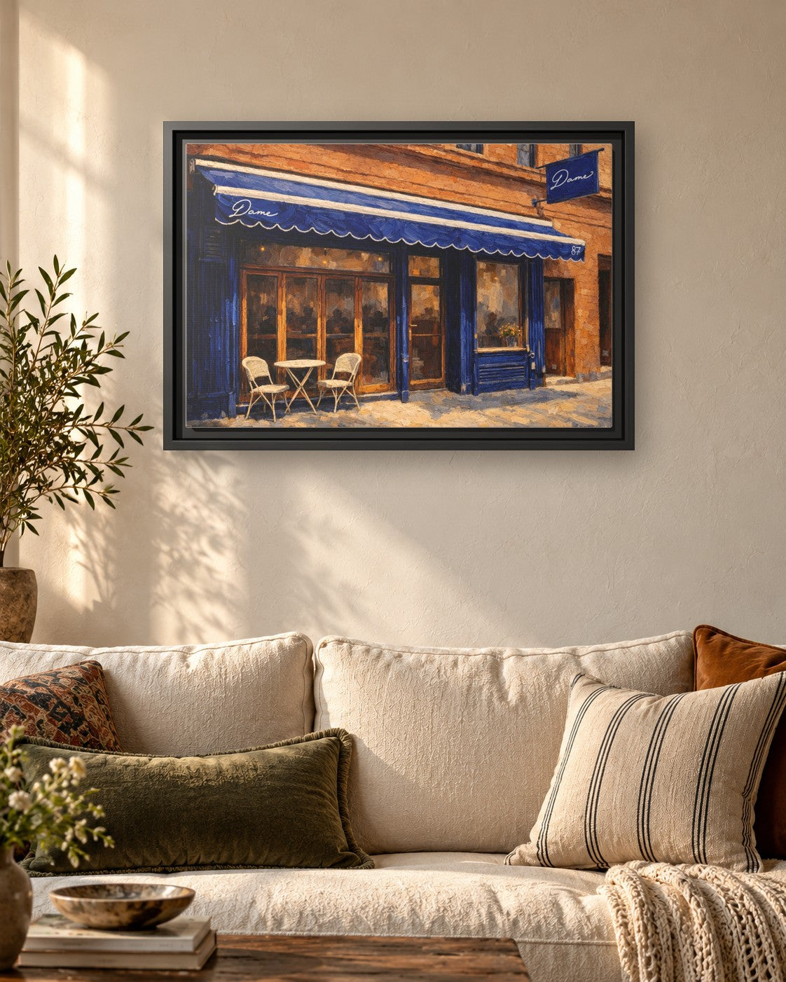 Dame framed canvas print hanging above a sofa