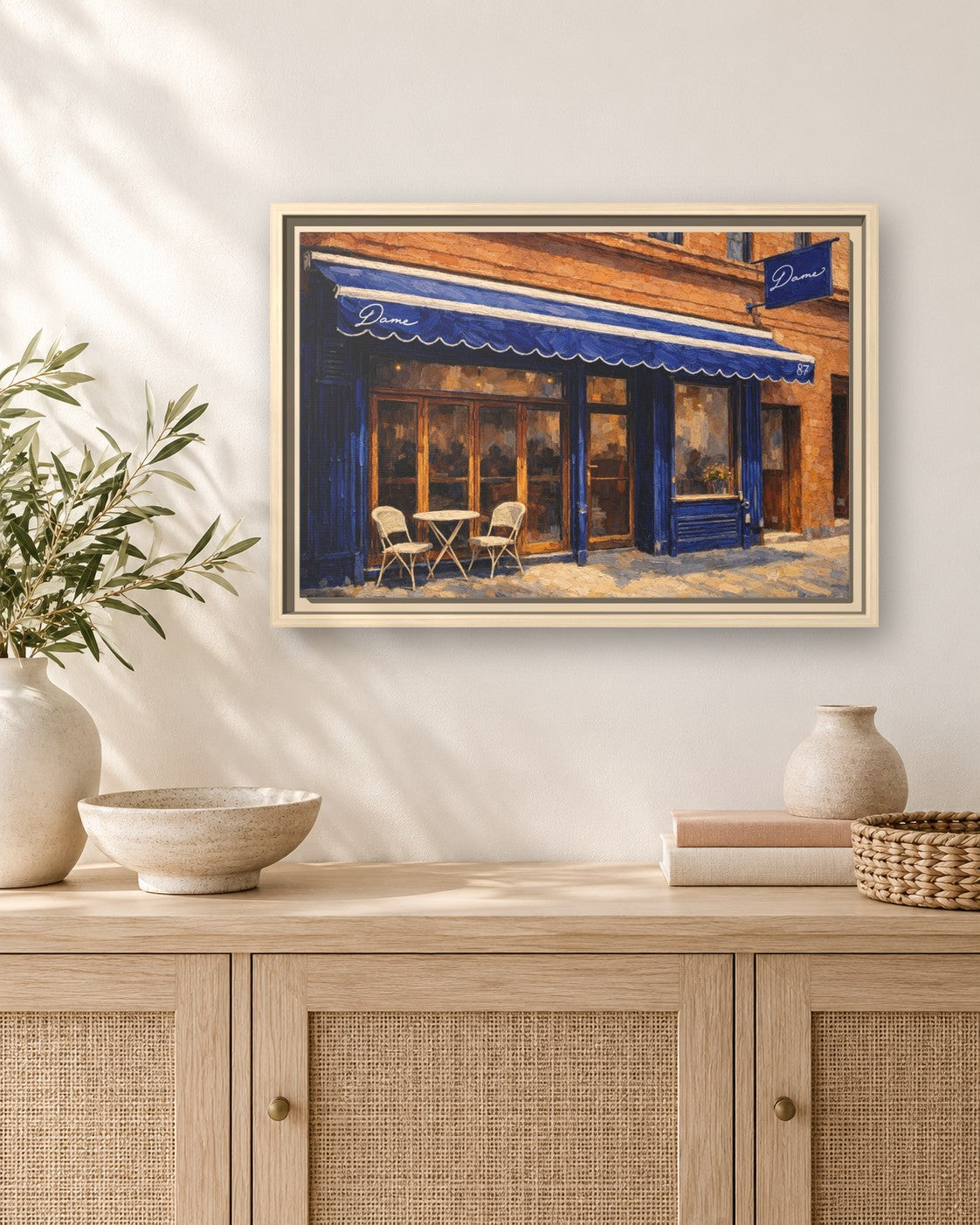 Dame framed canvas print hanging above a sideboard