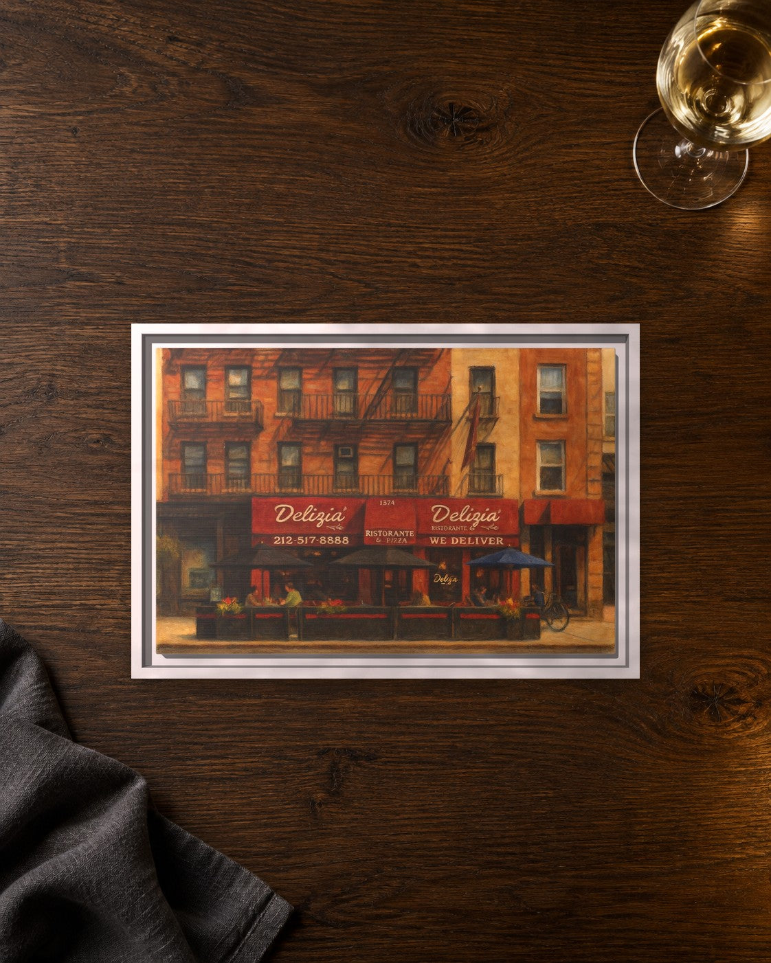 Delizia Pizza framed canvas print lying on a table