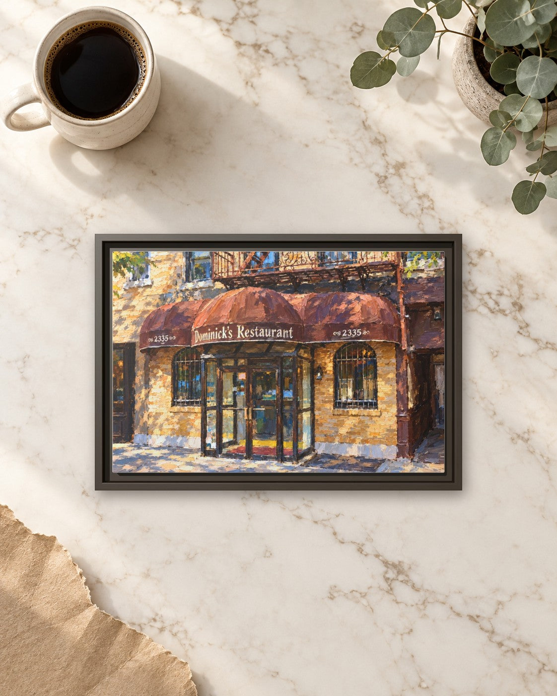 Dominick's Restaurant framed canvas print lying on a table