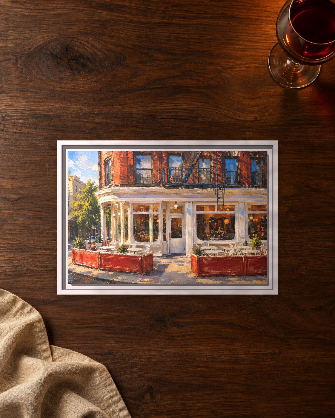 Don Angie framed canvas print lying on a table