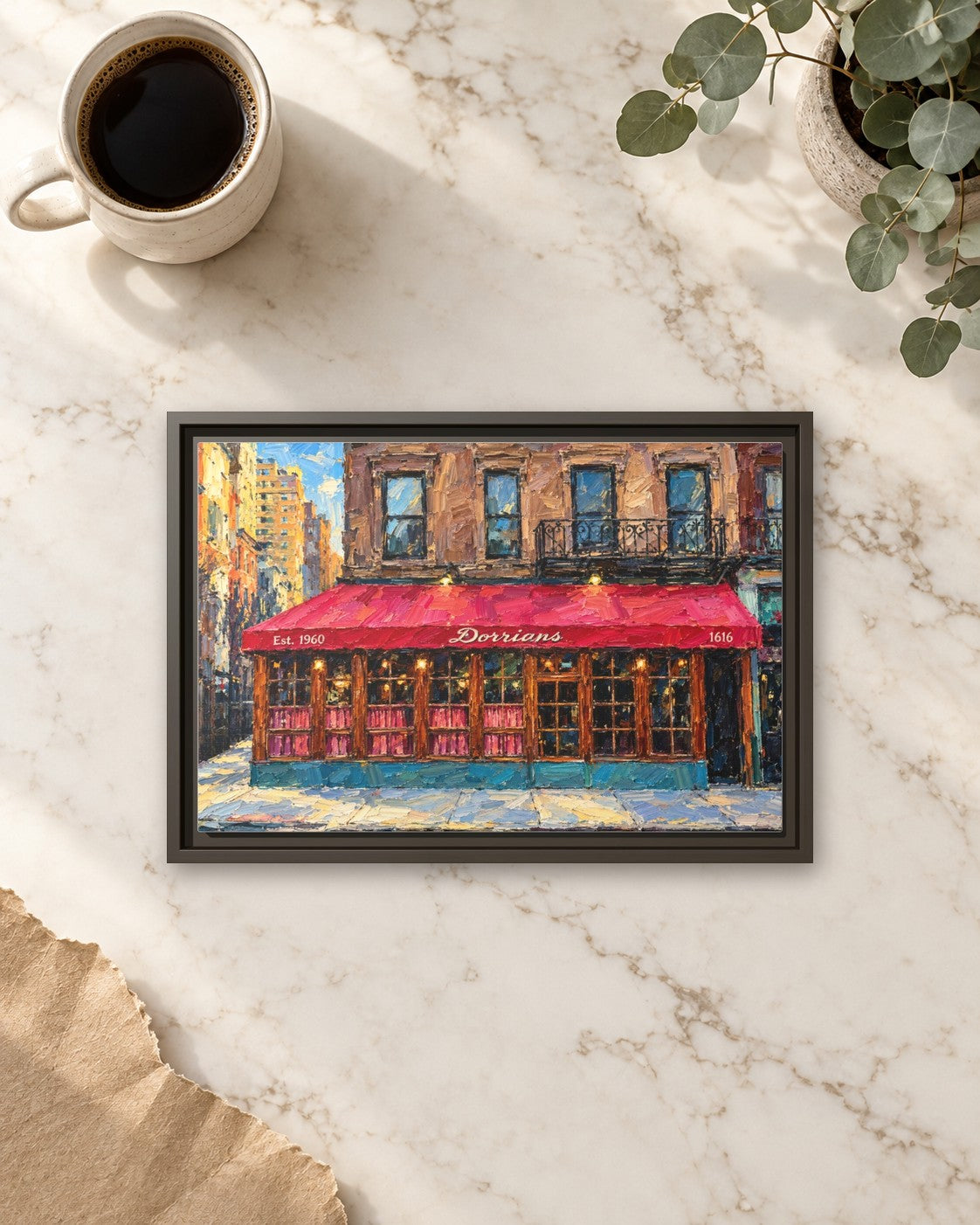 Dorrian's Red Hand framed canvas print lying on a table