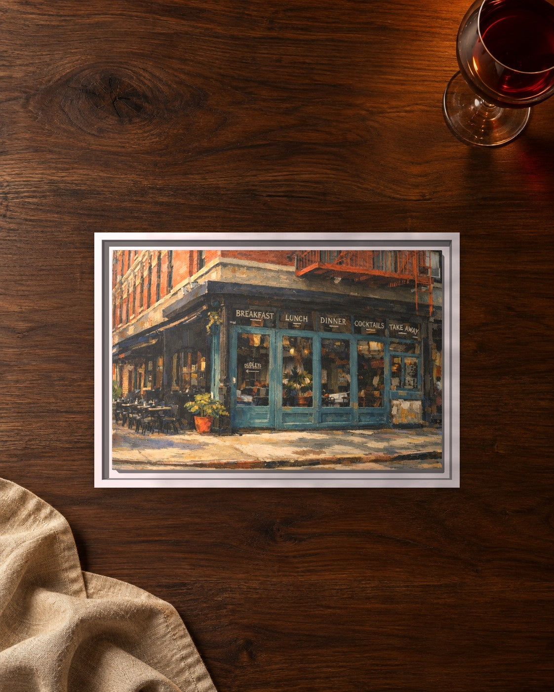 Dudleys framed canvas print lying on a table