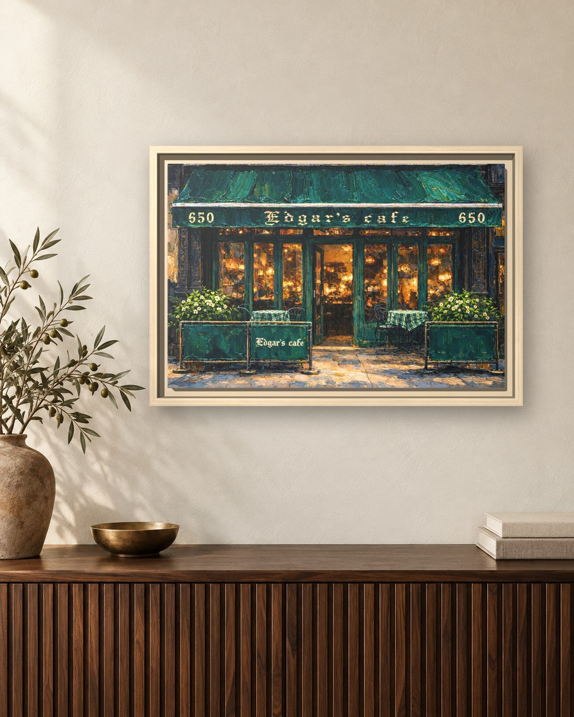 Edgar's Cafe framed canvas print hanging above a sideboard