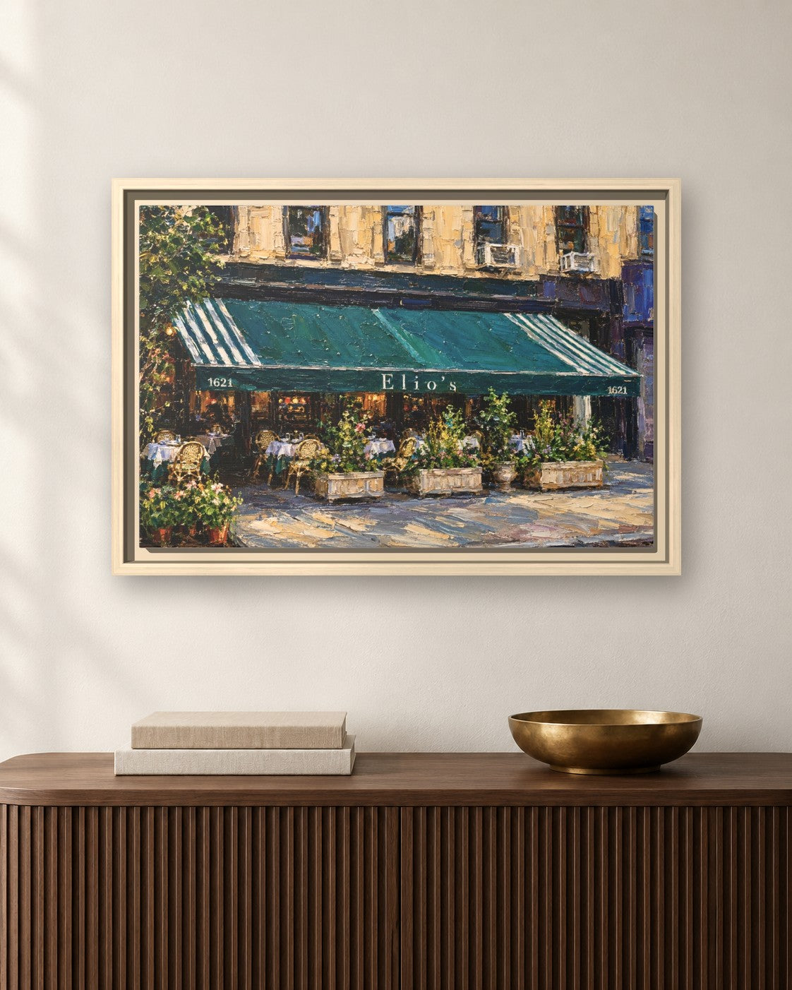 Elio's framed canvas print hanging above a sideboard
