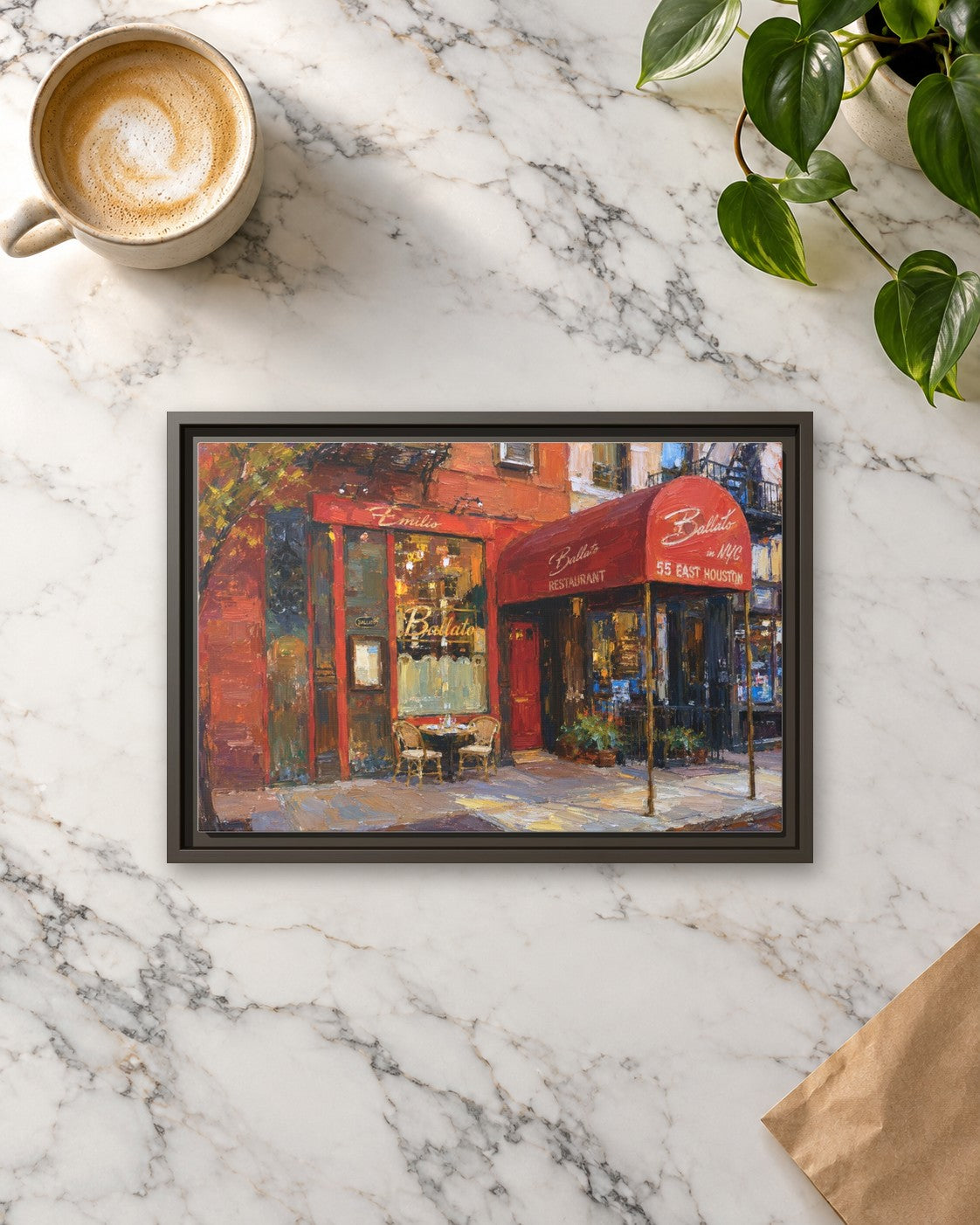 Emilio's Ballato framed canvas print lying on a table
