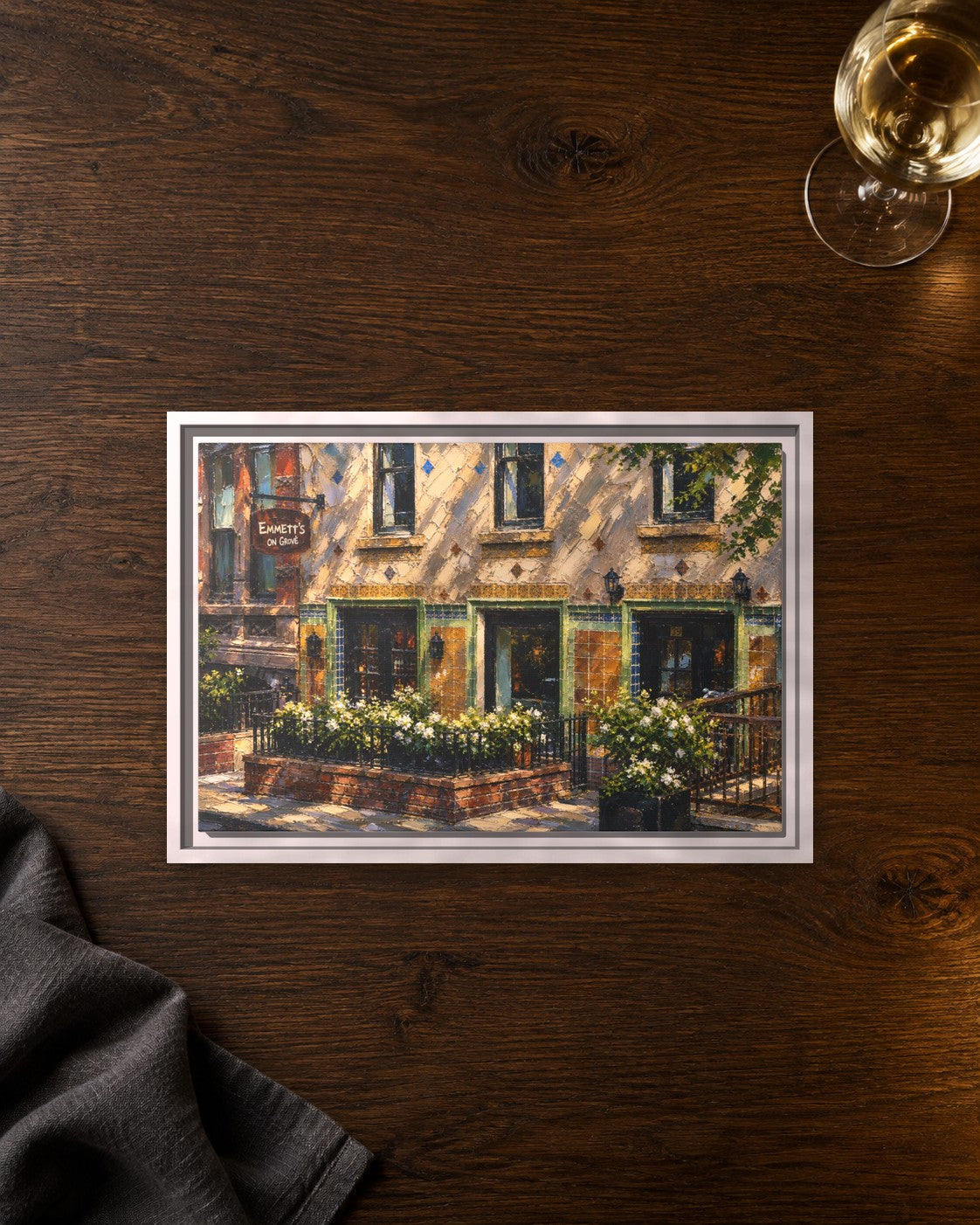Emmett's on Grove framed canvas print lying on a table
