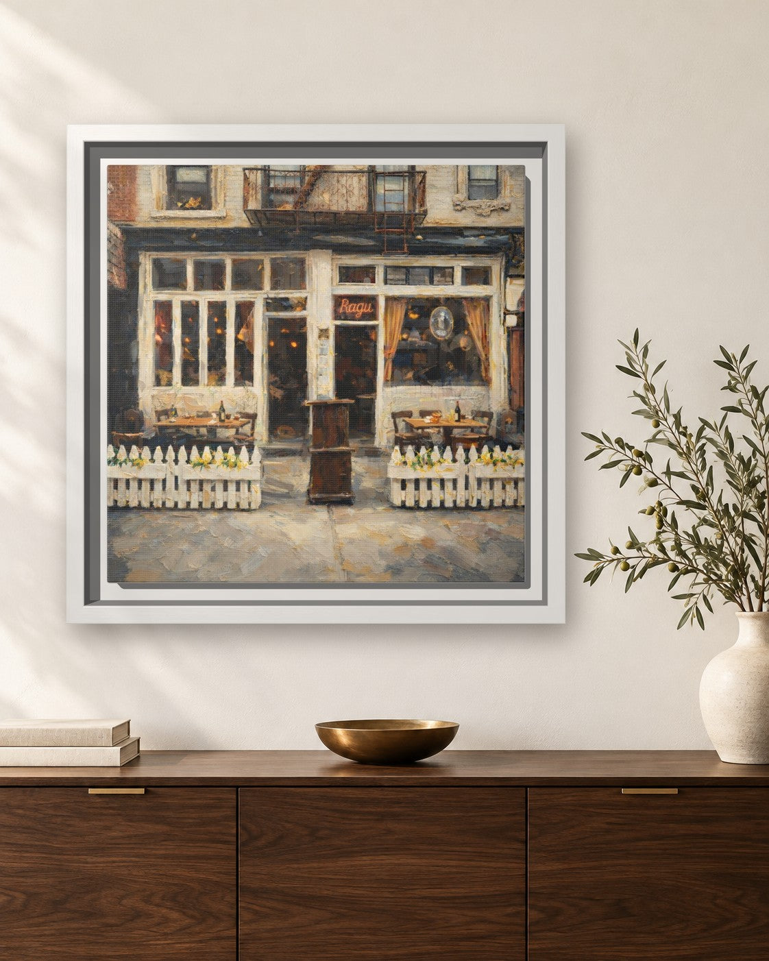 Frank framed canvas print hanging above a sideboard