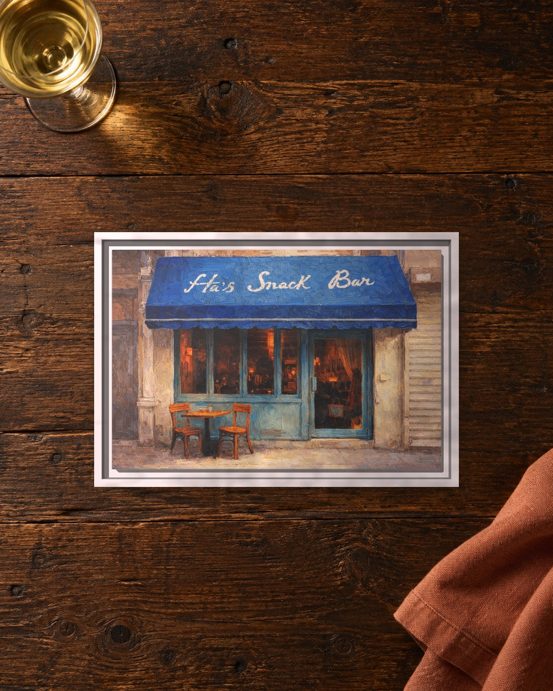 Ha's Snack Bar framed canvas print lying on a table
