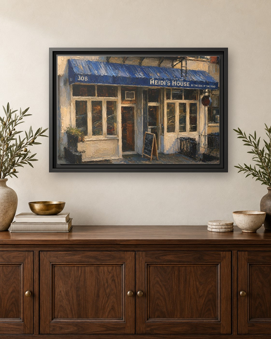 Heidi's House by the Side of the Road & Ed's Elbow Room framed canvas print hanging above a credenza