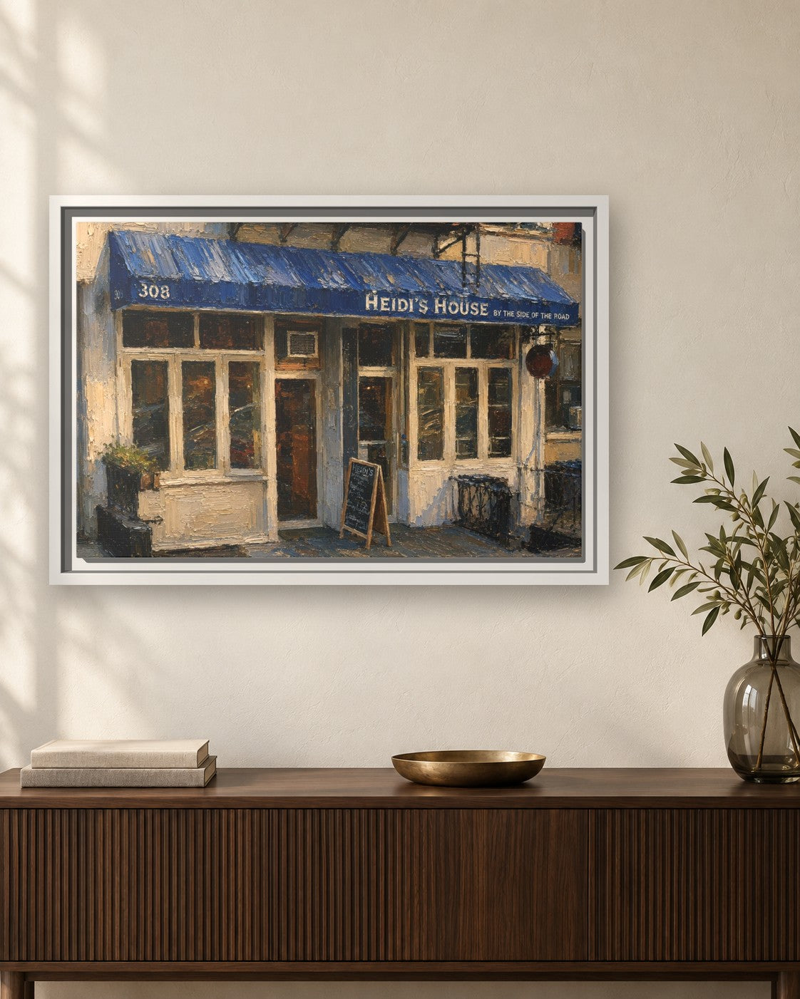 Heidi's House by the Side of the Road & Ed's Elbow Room framed canvas print hanging above a sideboard