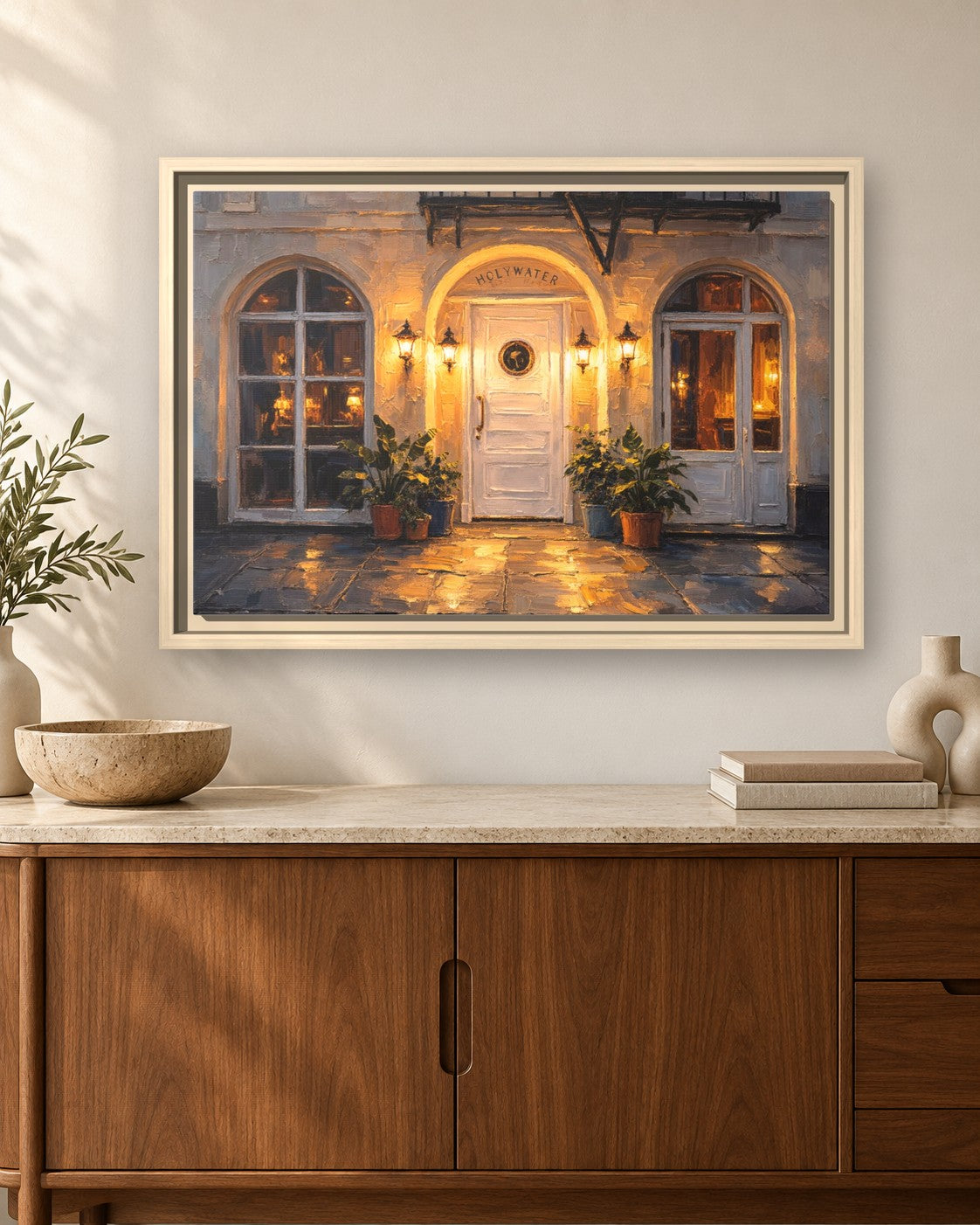 Holy Water framed canvas print hanging above a sideboard