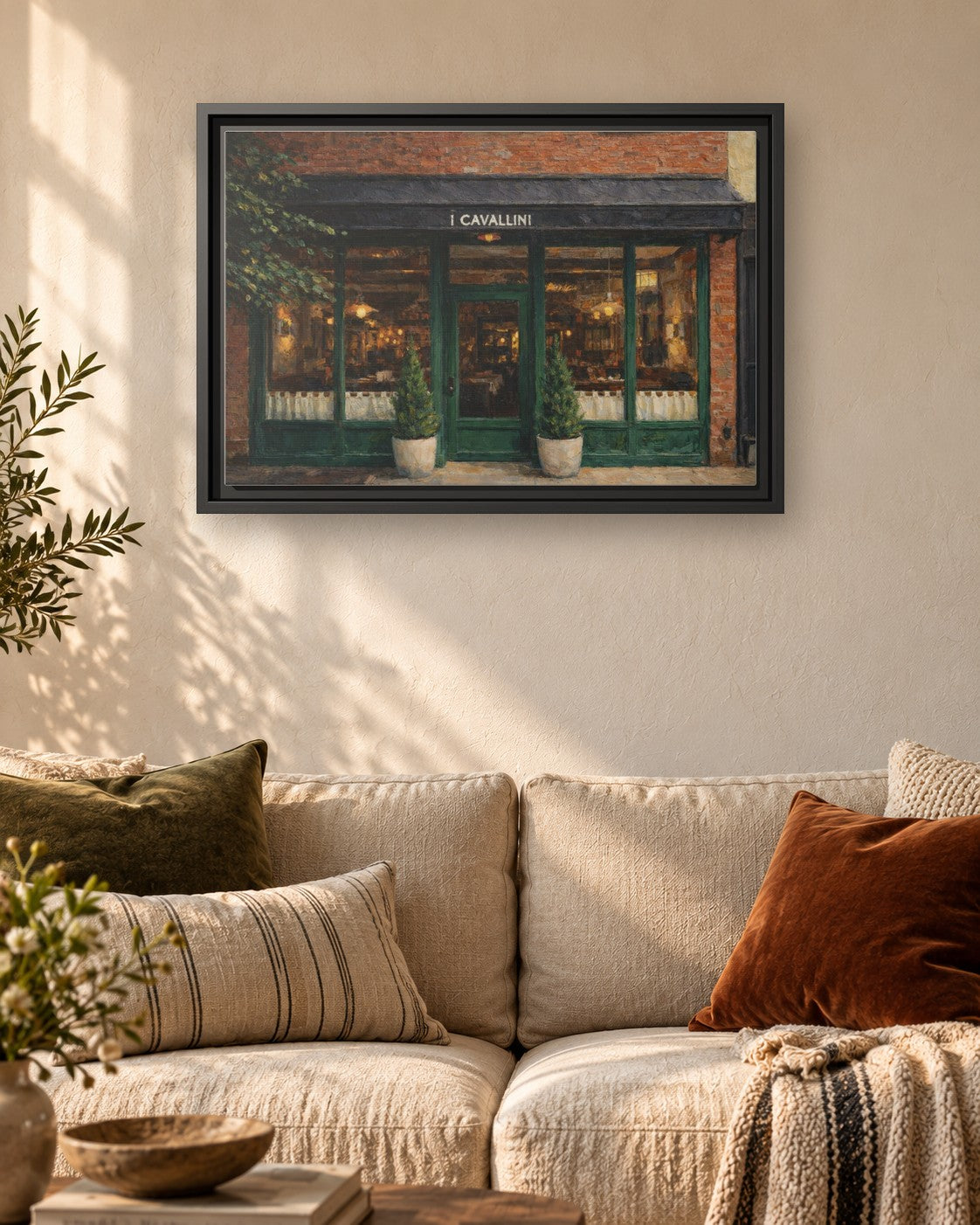 i Cavallini framed canvas print hanging above a sofa