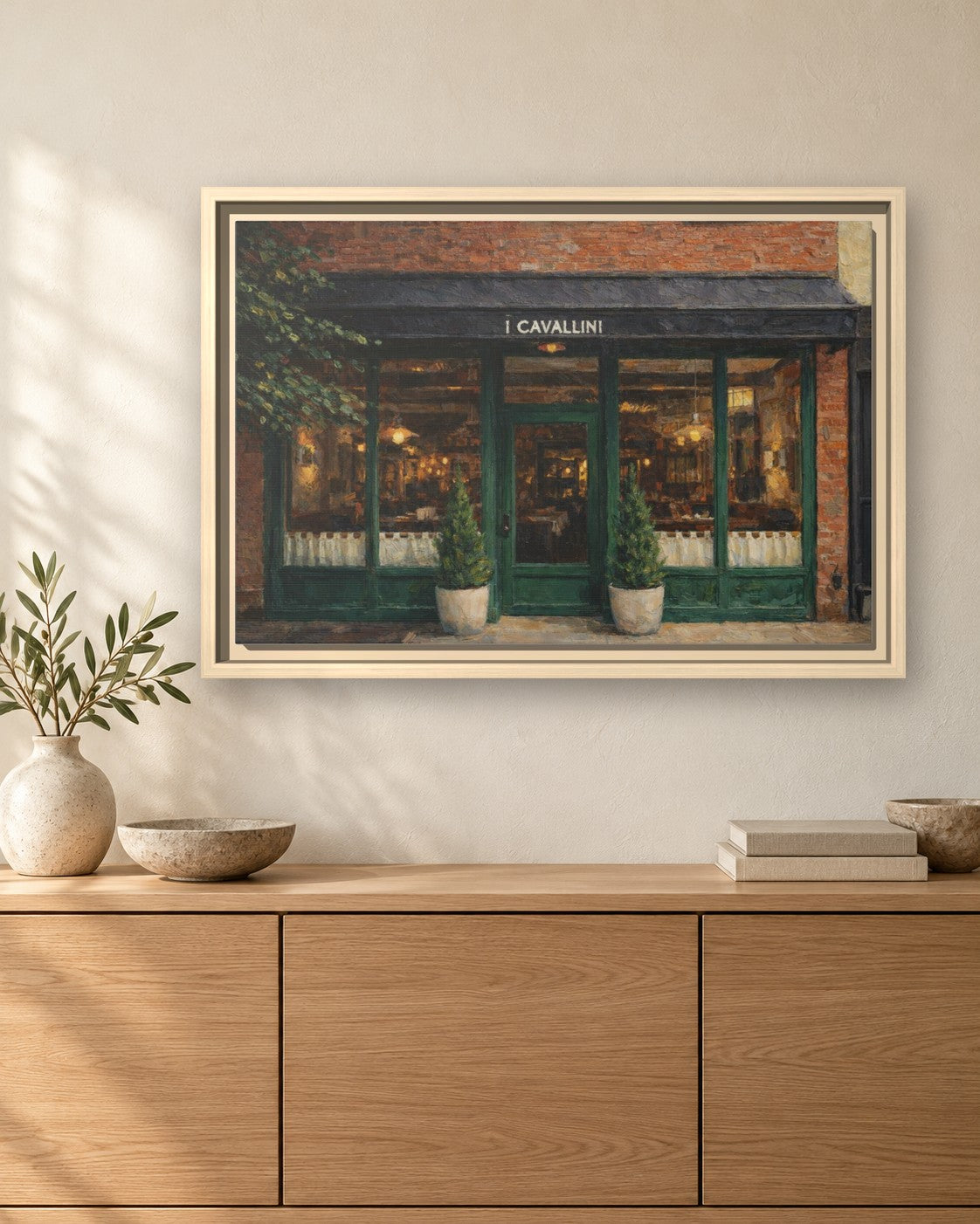 i Cavallini framed canvas print hanging above a sideboard