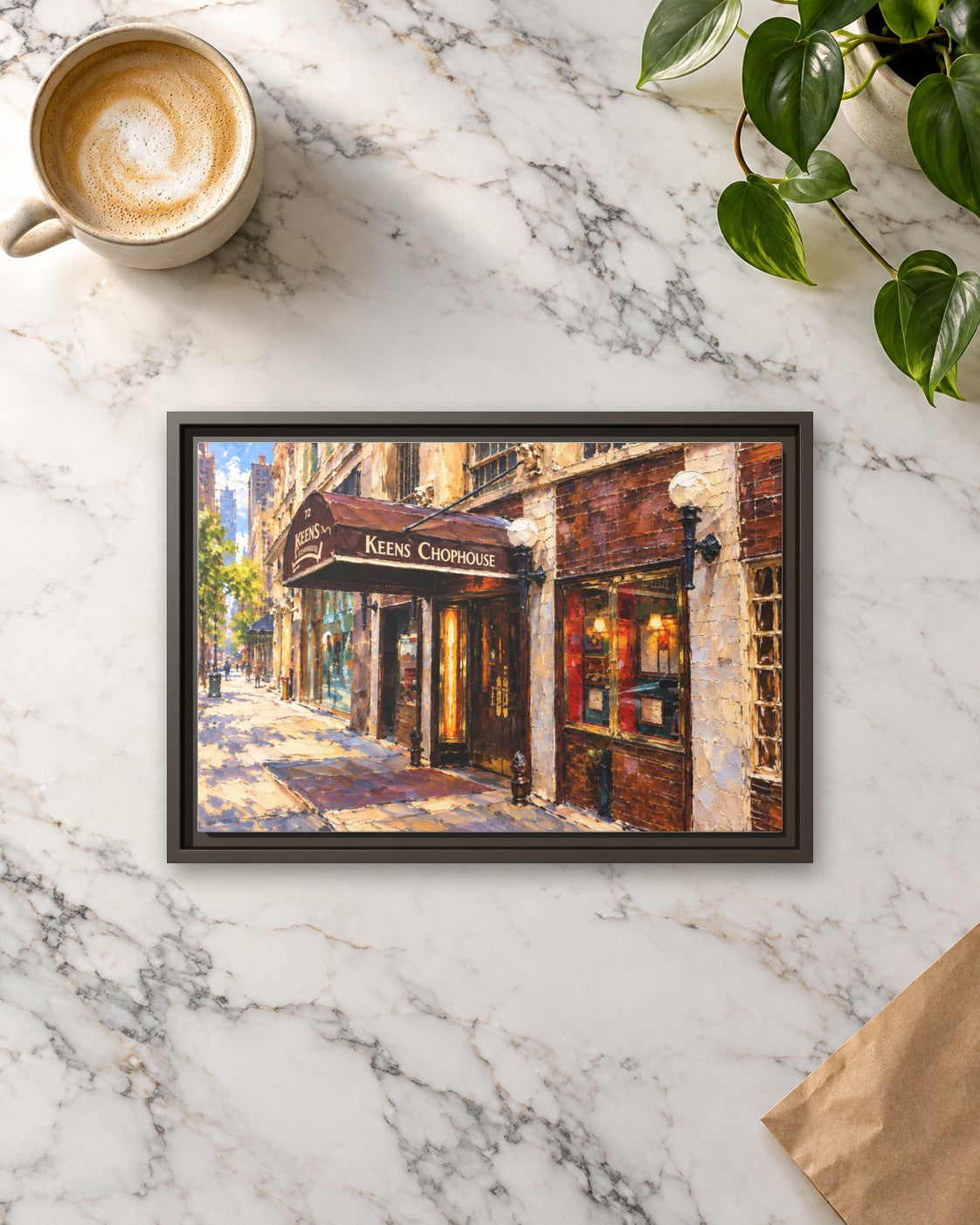 Keens Steakhouse framed canvas print lying on a table