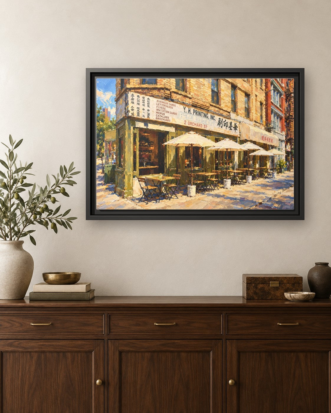 Kiki's framed canvas print hanging above a credenza