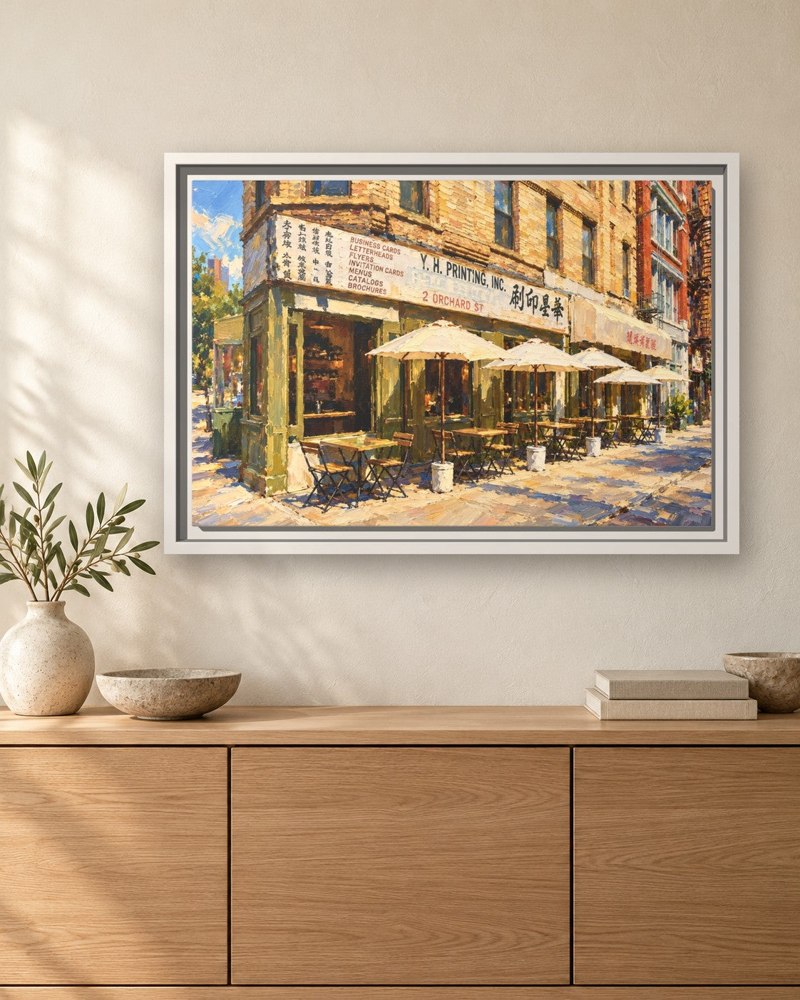 Kiki's framed canvas print hanging above a sideboard
