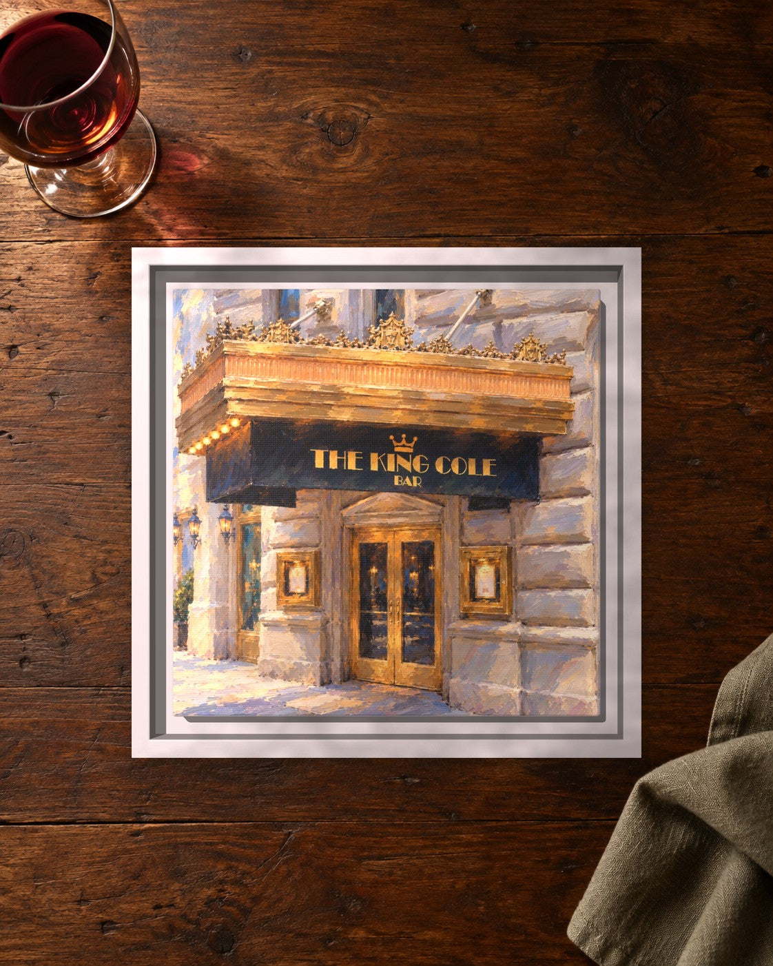 King Cole Bar framed canvas print lying on a table