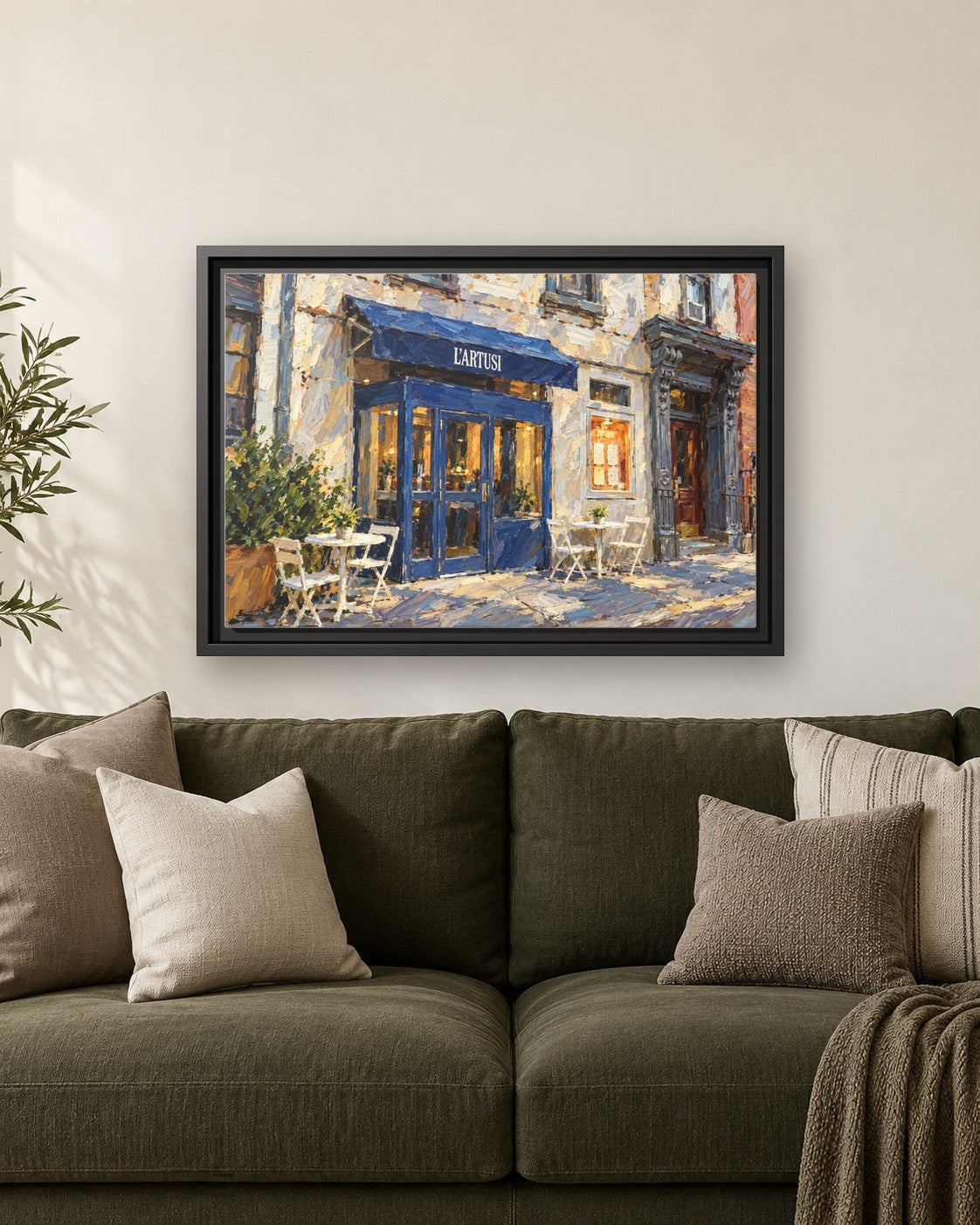 L'Artusi framed canvas print hanging above a sofa
