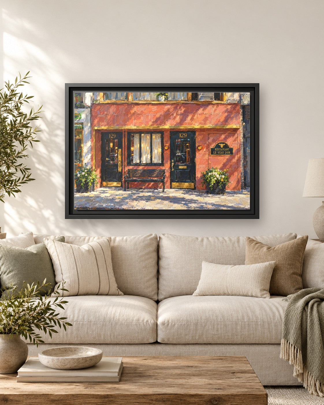 Le Veau d’Or framed canvas print hanging above a sofa