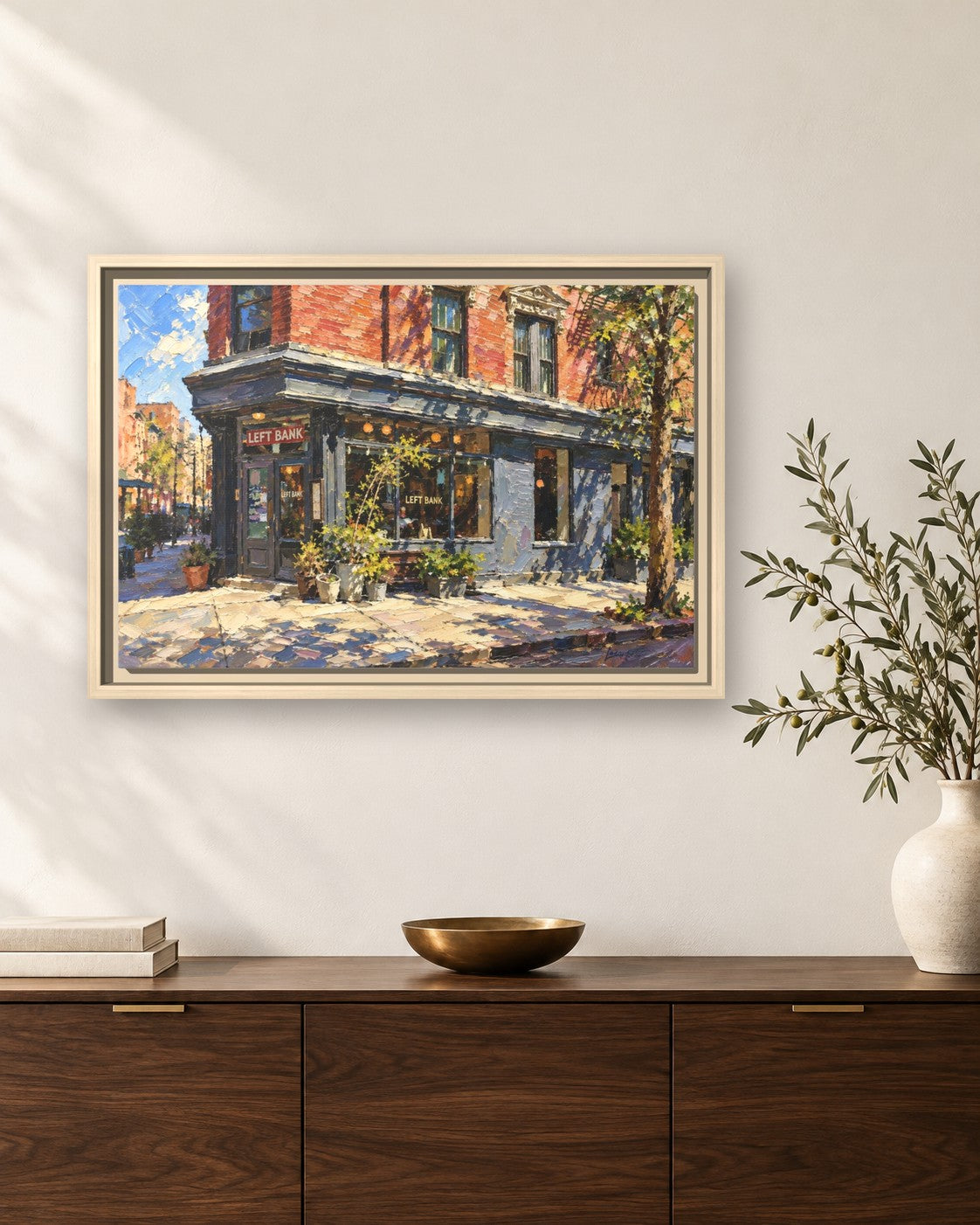 Left Bank framed canvas print hanging above a sideboard