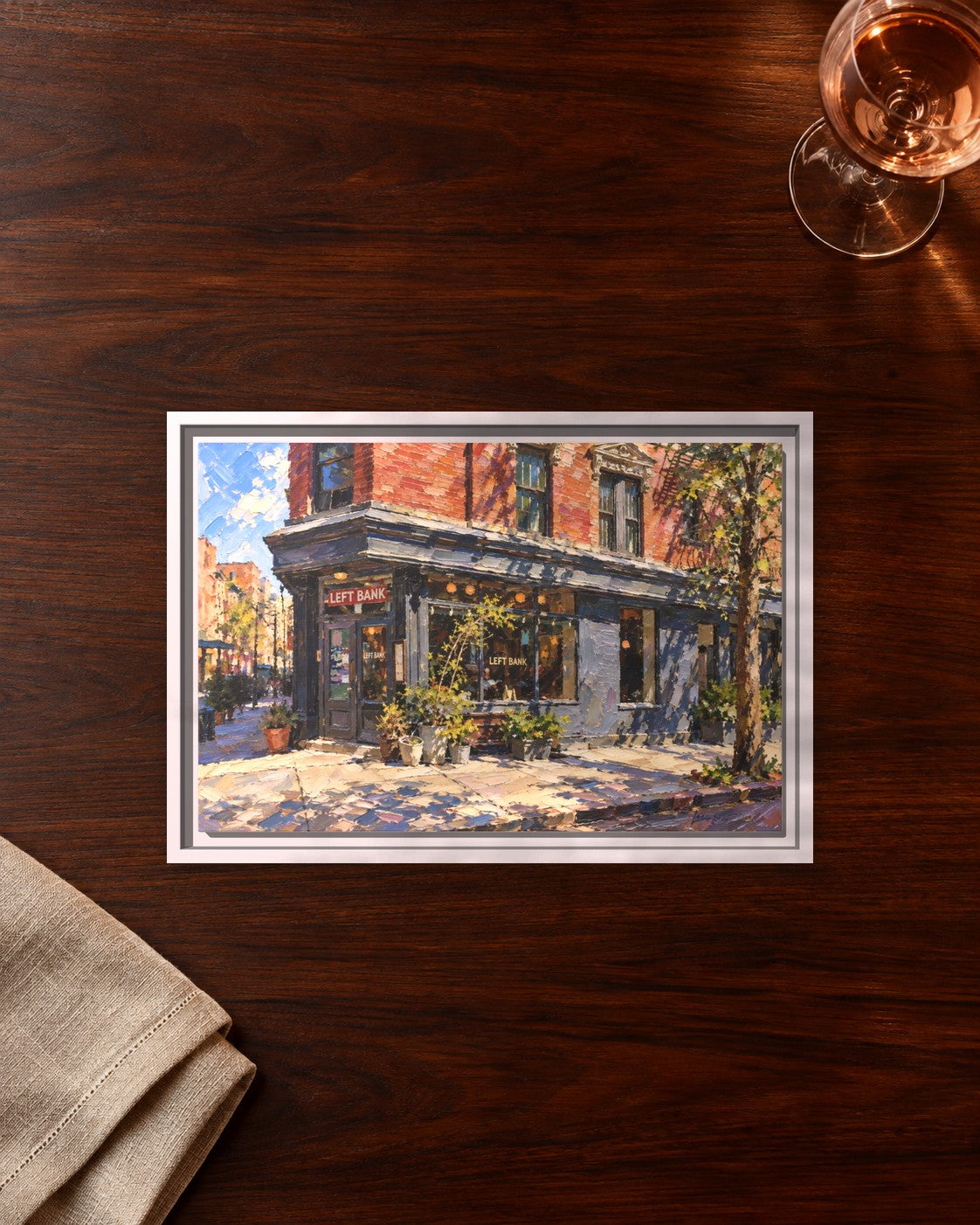 Left Bank framed canvas print lying on a table