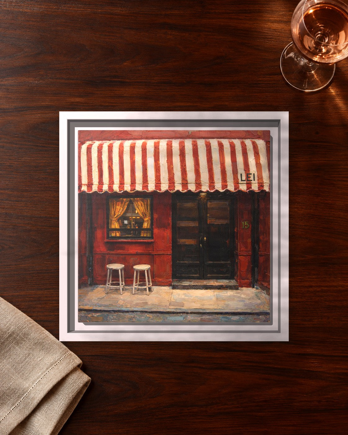 Lei framed canvas print lying on a table